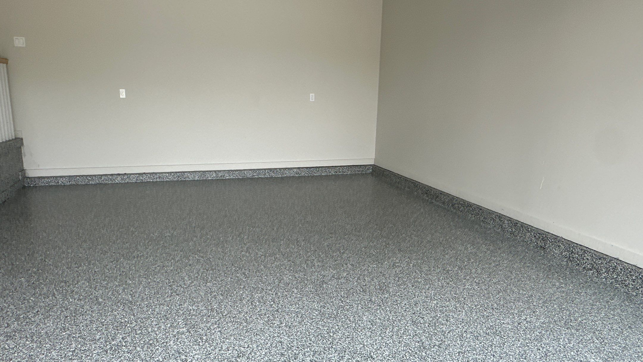 Check out how beautiful a brand new stonehenge flake floor looks by Banner Garage
