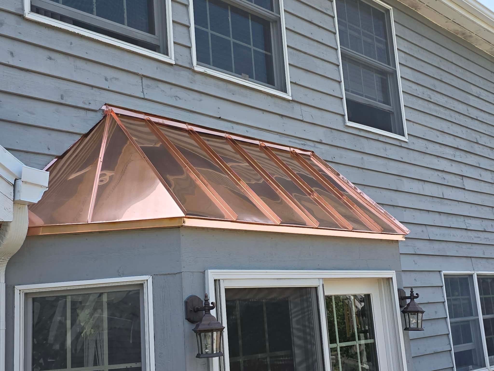 Roofing, copper chimney cap and copper awning by Optimal Home Improvement 