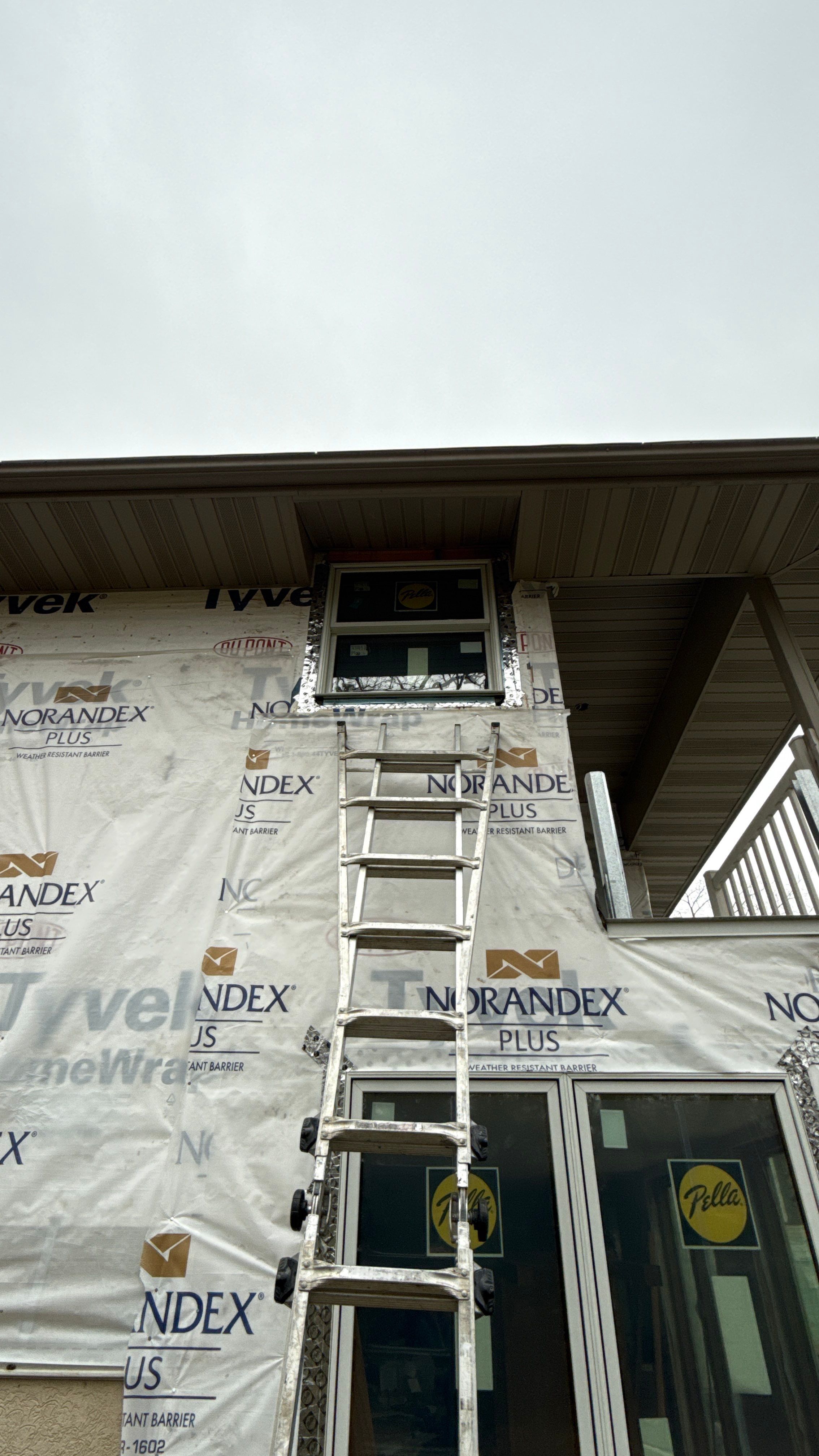 A Clean Window Upgrade Ready for New Siding with Pella Lifestyle Series by United Windows and Siding LLC