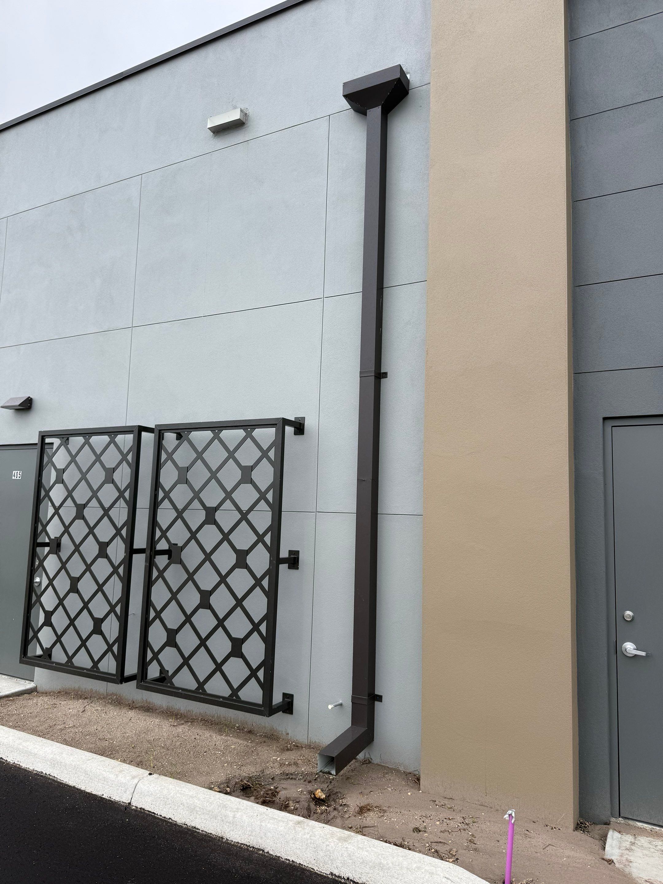 Downspout Installation using collector head in Cape Coral FL by Gutter Professors