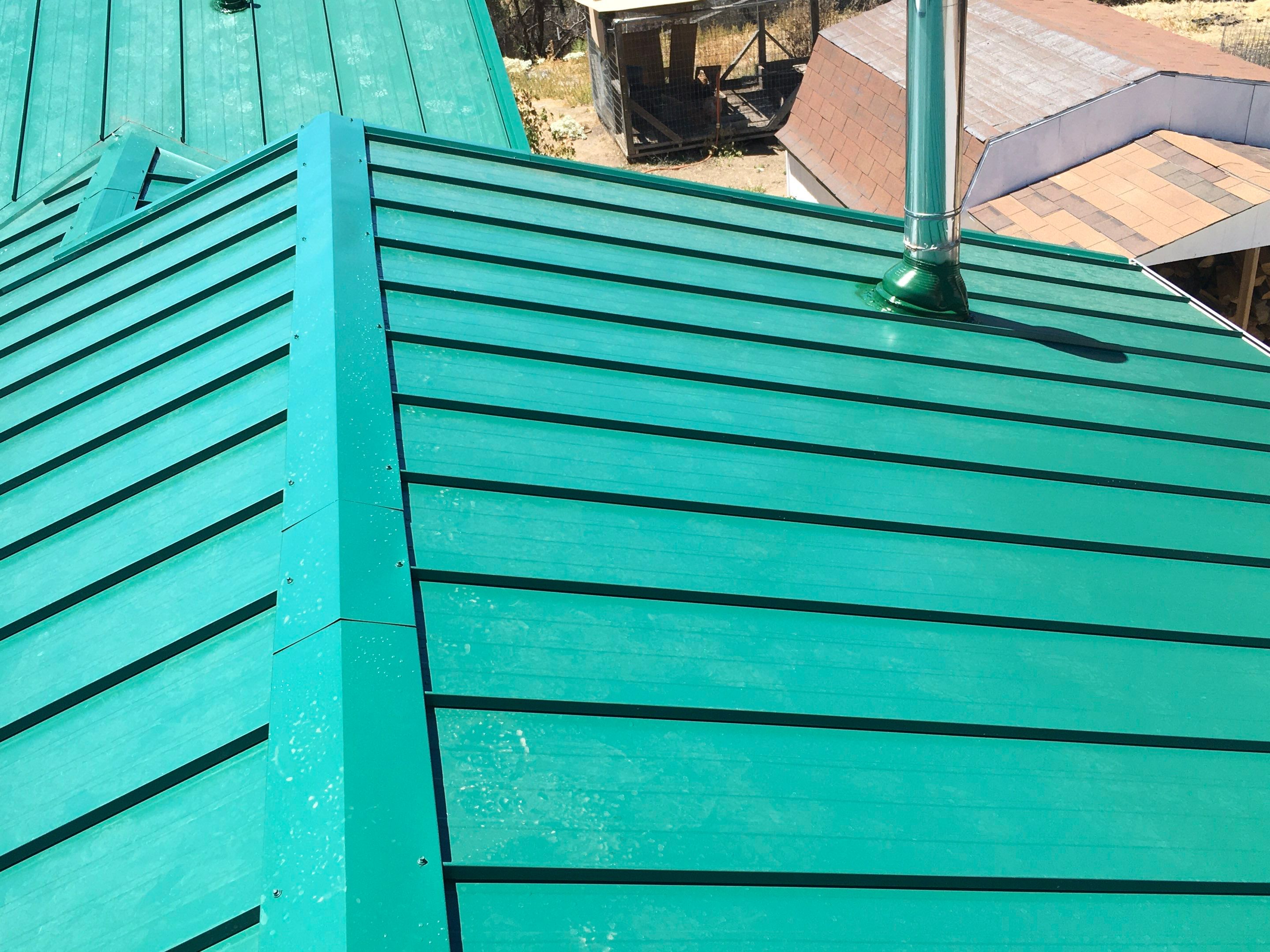 Metal roofing installation using Standing seam metal roofing system by Straight Edge Roofing Inc