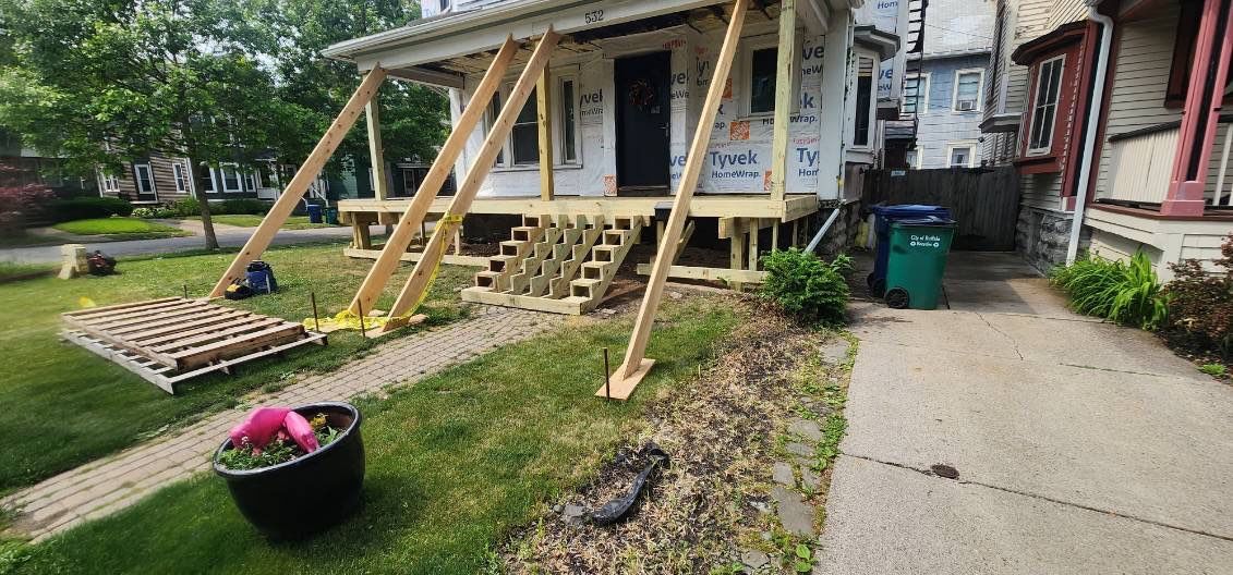 Exterior Renovations- Siding, Stamped Concrete, Porch, and Railings by Ivy Lea Construction