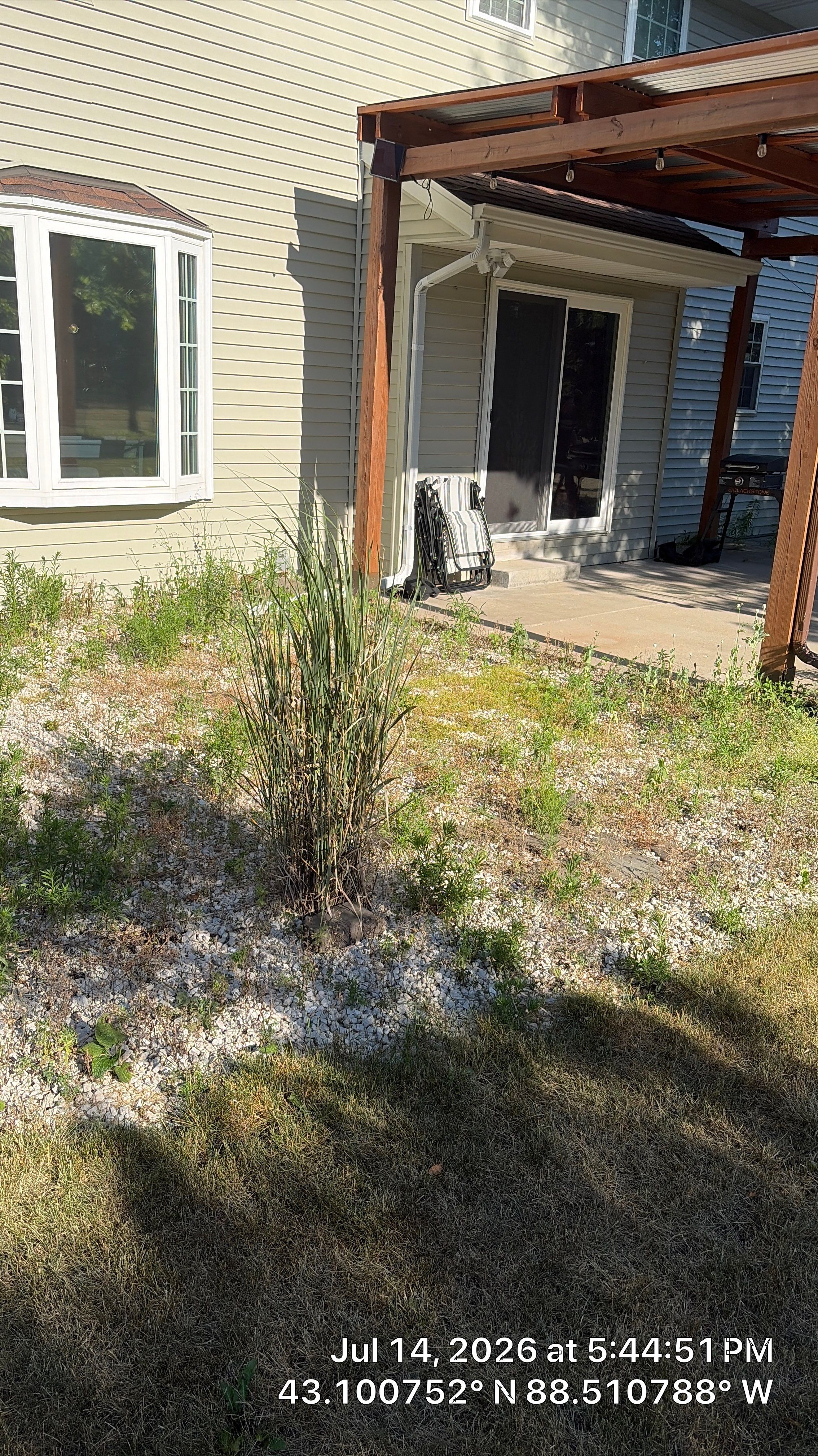 Decorative Stone and River Rock Landscaping for Oconomowoc Residence by CompanyCam Sales Demo