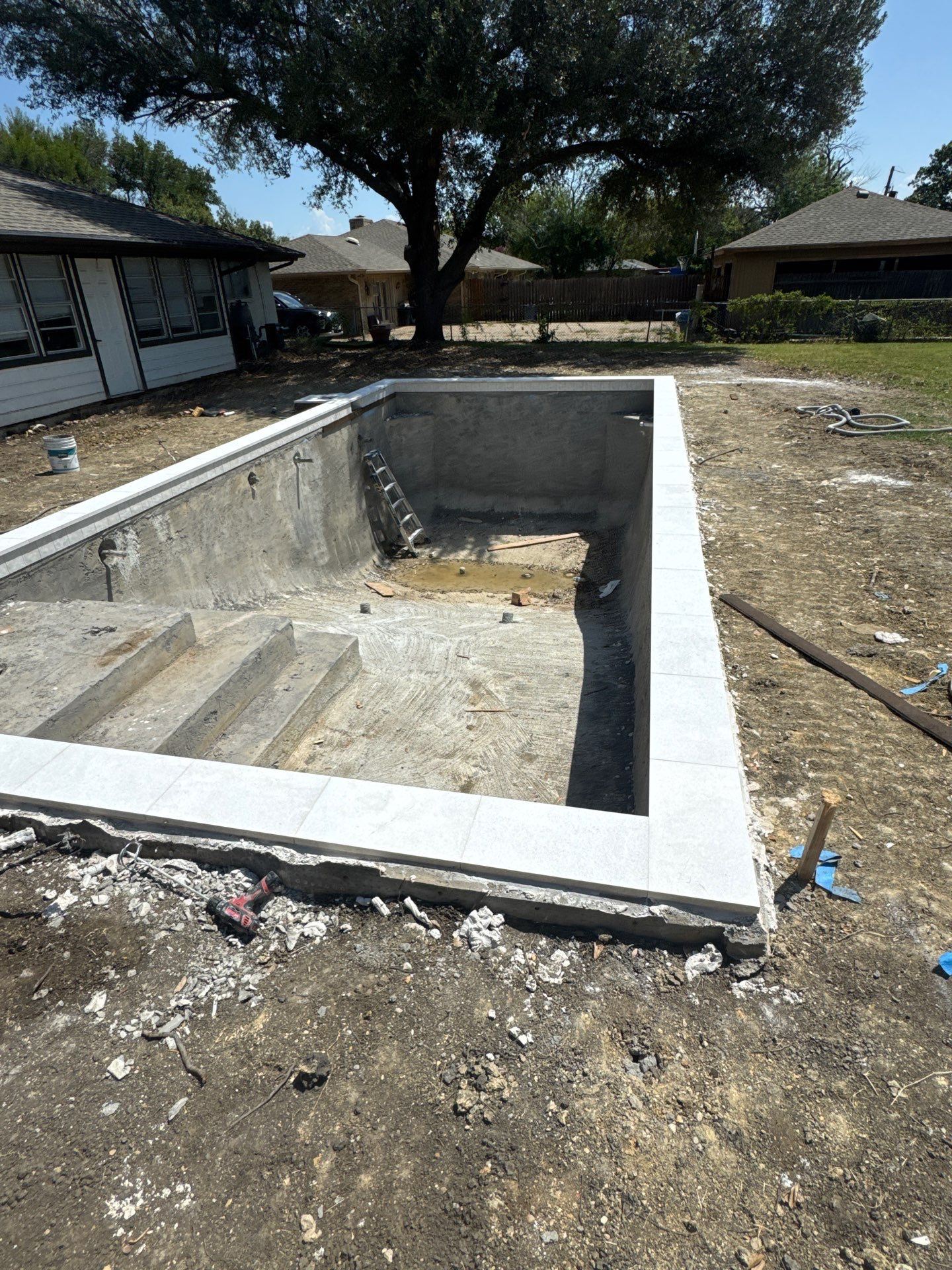 Crisp Geometric Pool with White Coping by Pinnacle Pools and Spas - DFW