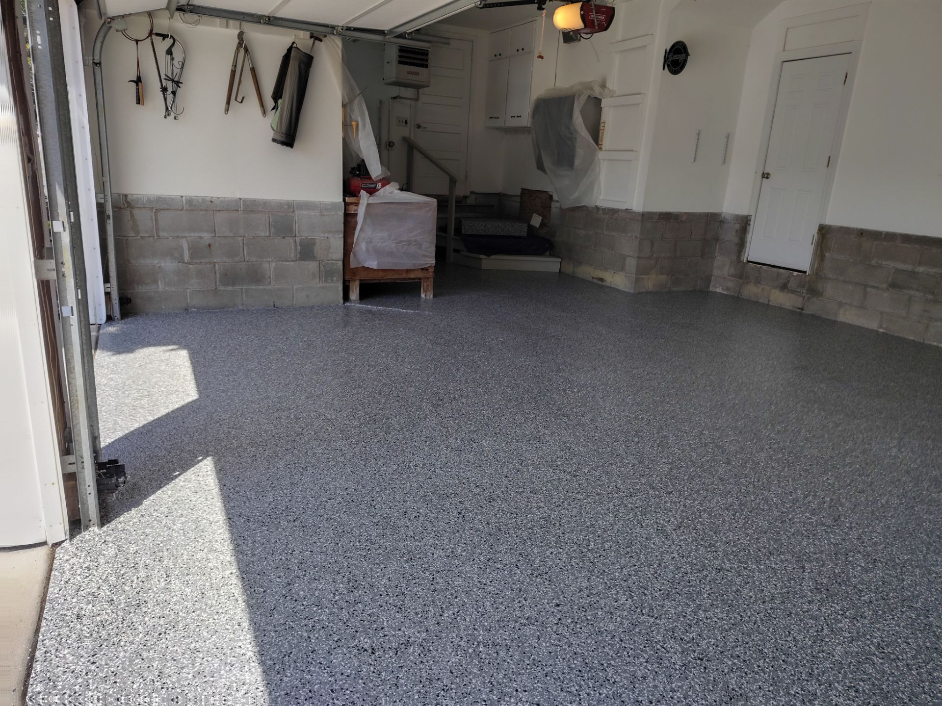 Wombat Flake Garage Floor Coating in Perry, IA by Revival Concrete Coatings