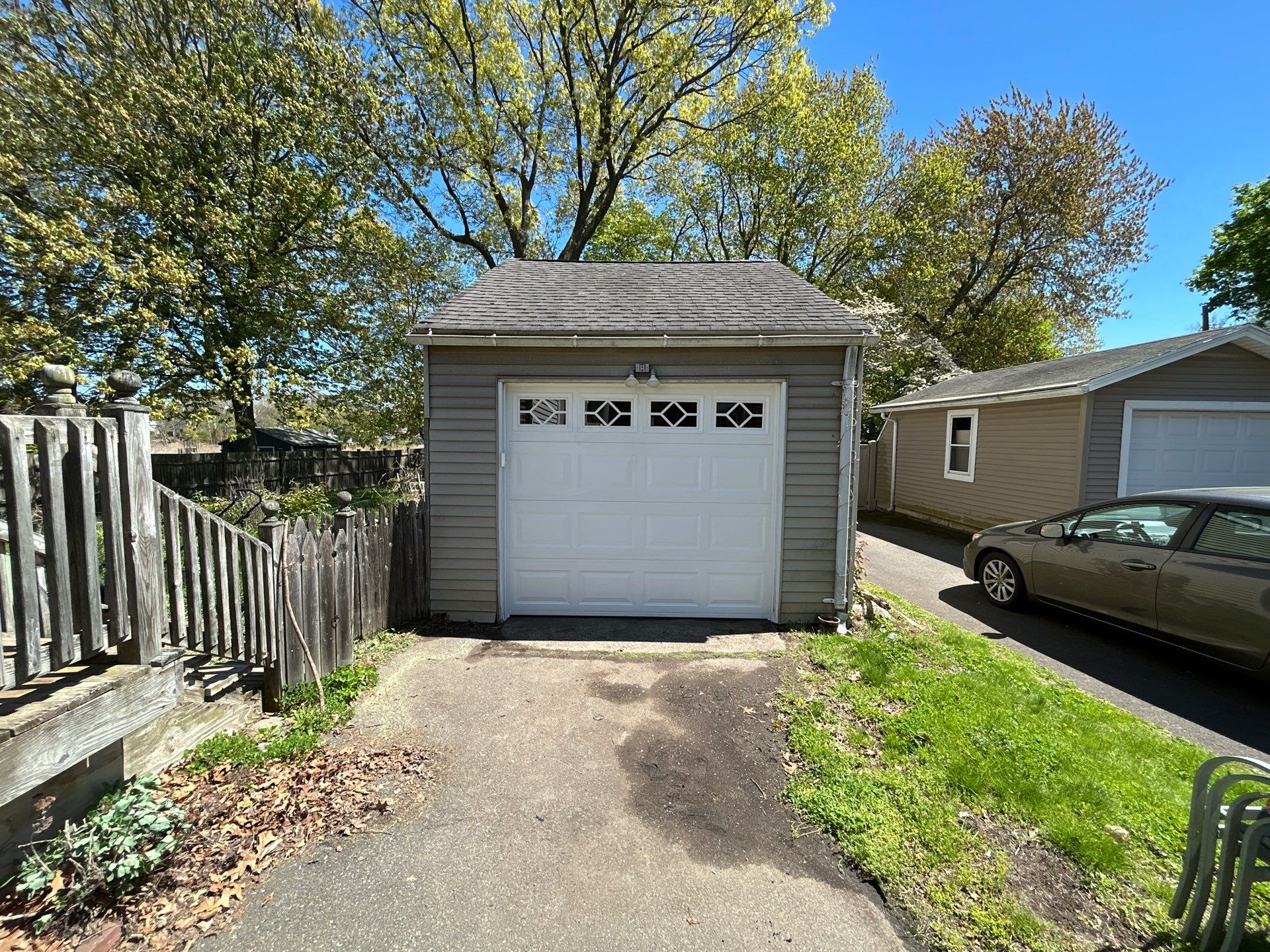 Garage Door Upgrade with Decorative Window Inserts by DiGiorgi Roofing and Siding Inc