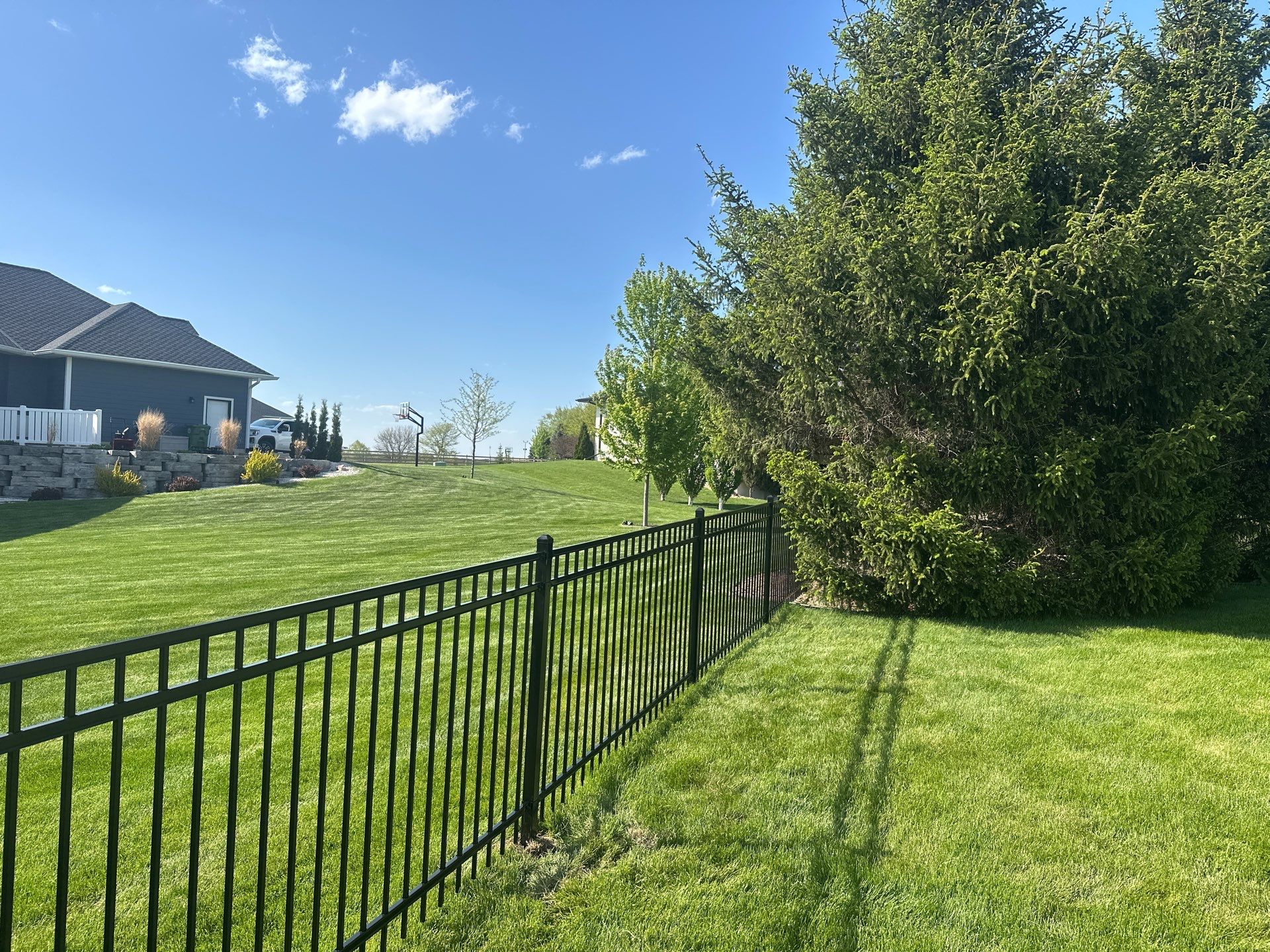 Black Ornamental Metal Picket Fence Installation in Waterloo by Perfect Picket Fence and Stain