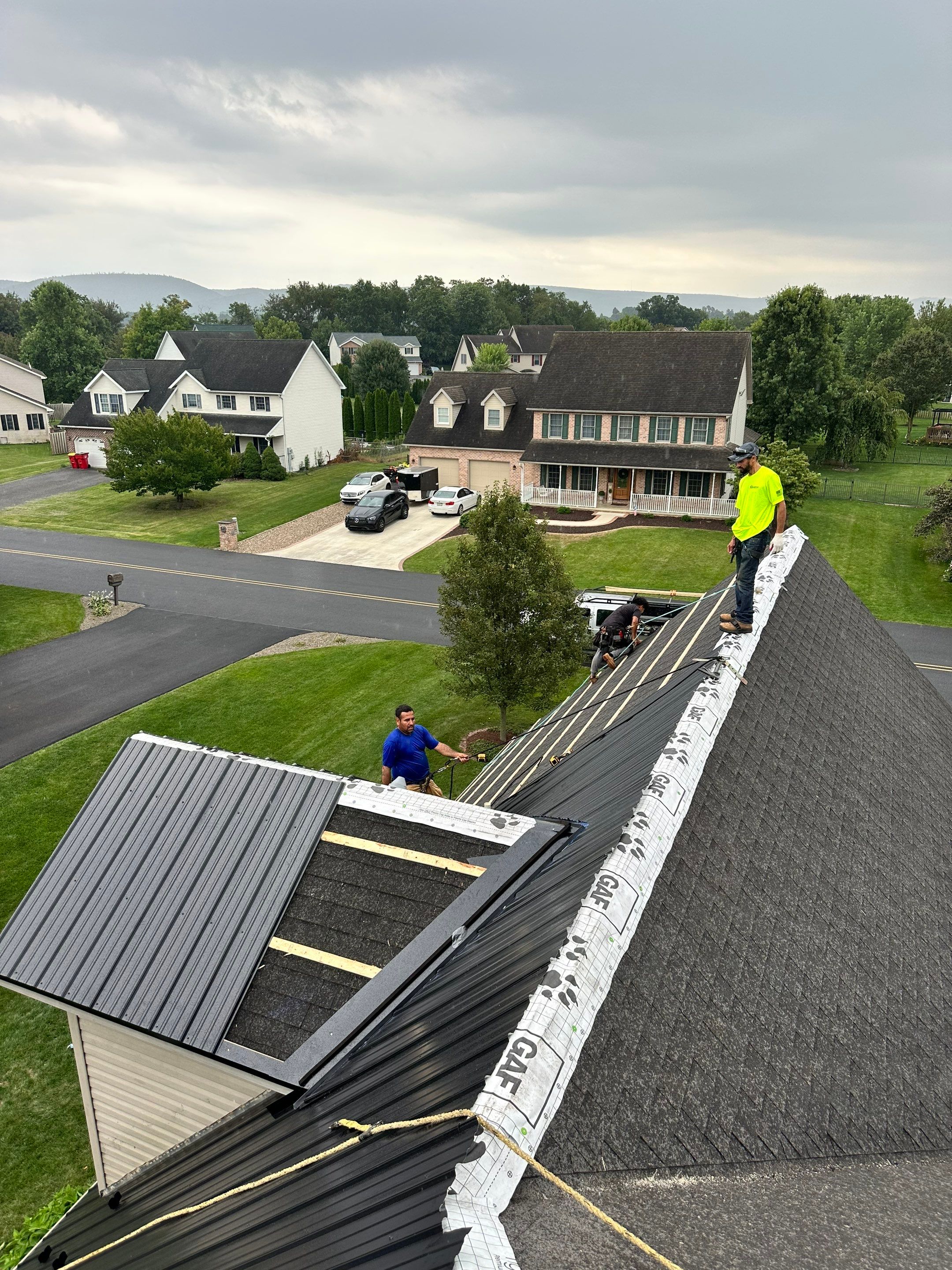 Standing seam / Azm panel in black  by Teflon Roofing
