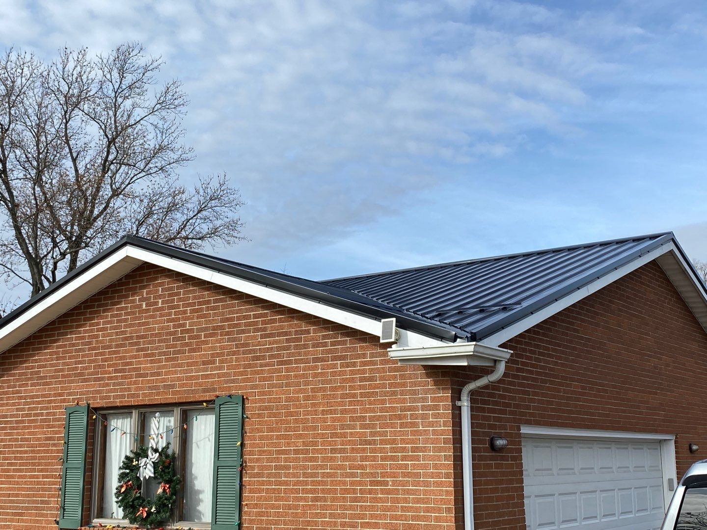 Residential Roofing Installation using Perfromance Panel Metal - Black by RoofX 