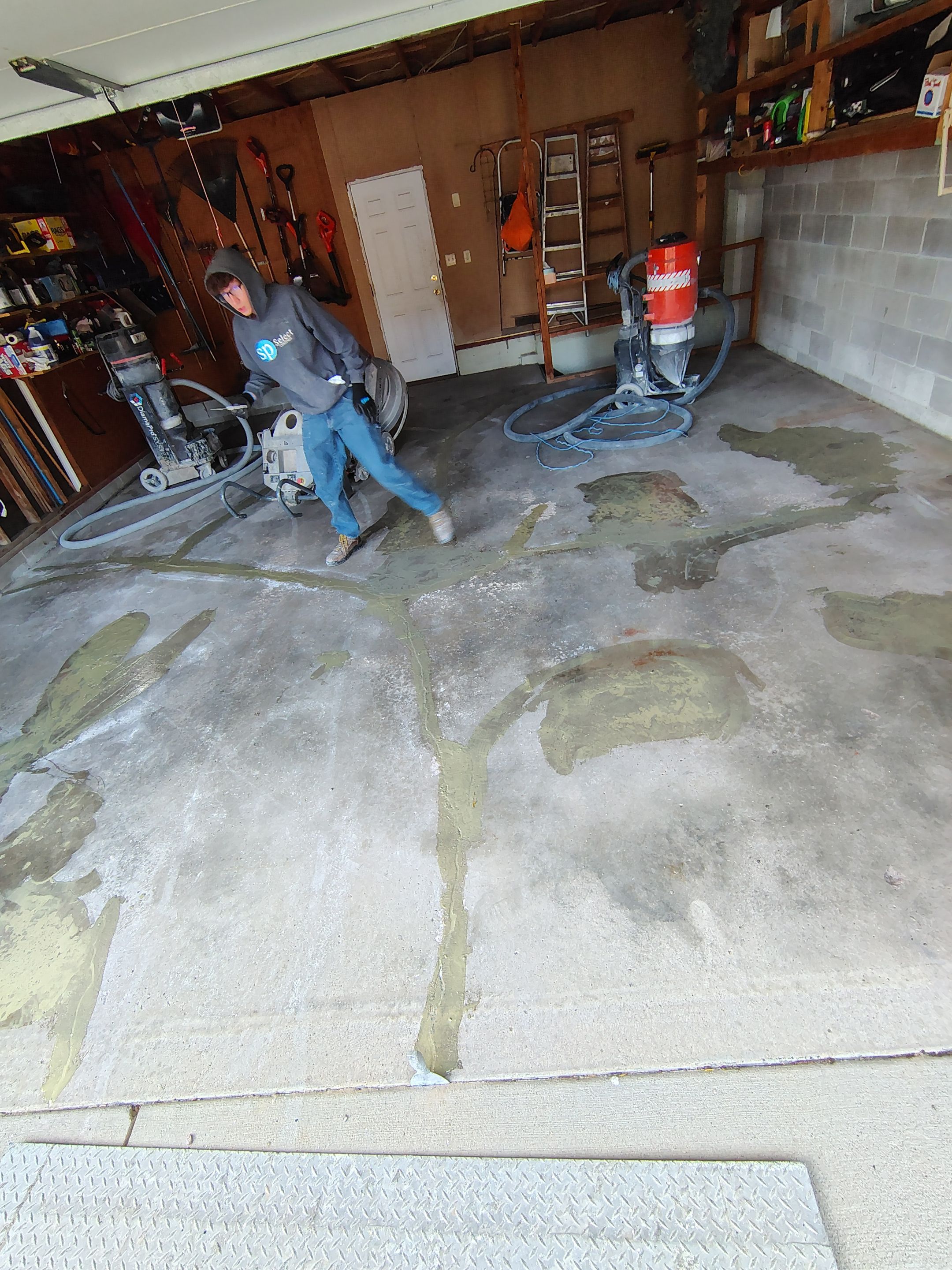 Sioux Falls Garage Epoxy Floor Installation and Concrete Crack Repair by Select Painting, Coatings & Garage Cabinets