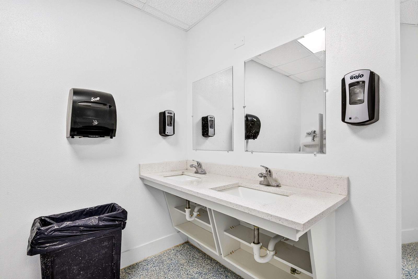 Commercial Restroom Renovation with Epoxy Flooring in Sarasota by Vertical General Contracting 