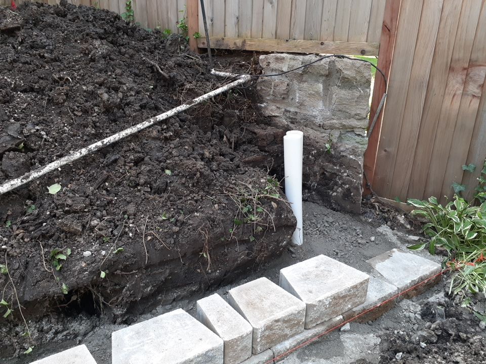 Back Yard Harington Retaining Wall by LAND ESCAPES LLC