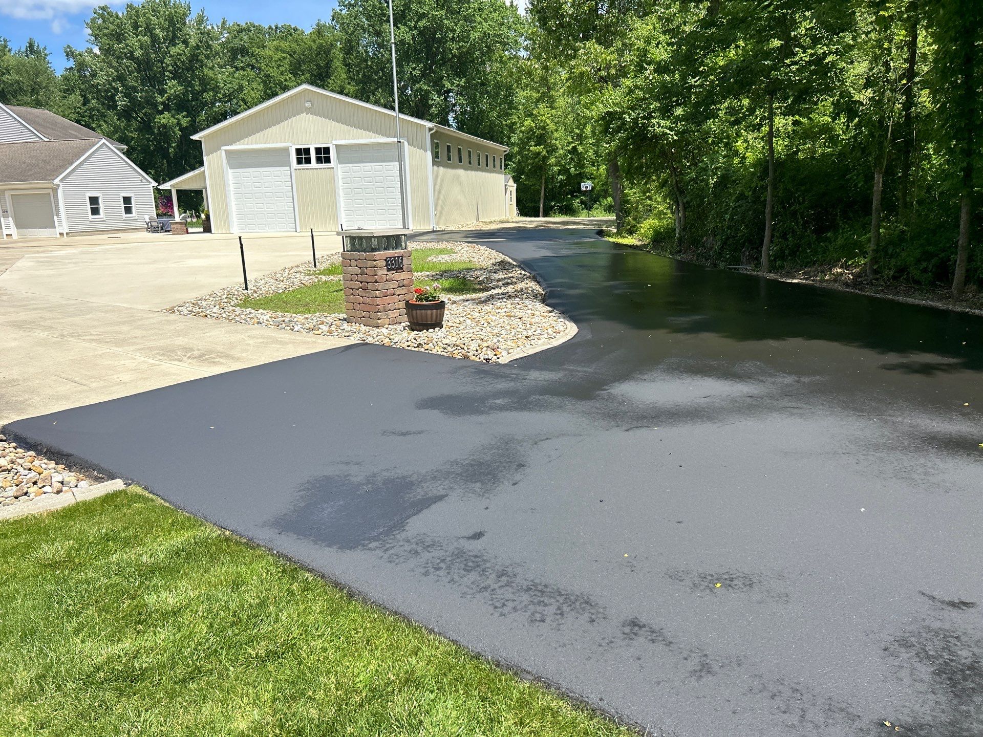 High end residential driveway by Quality Asphalt & Maintenance LLC