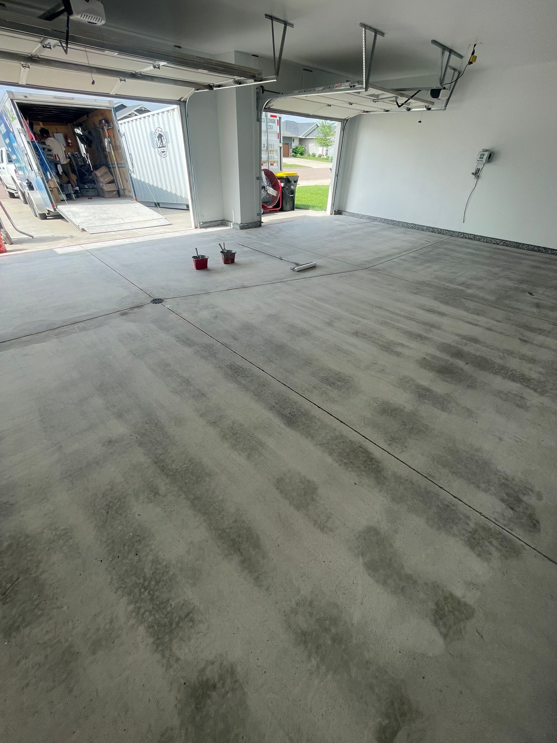 Grey Flake Epoxy Garage Floor Coating in Sioux Falls by Select Painting, Coatings & Garage Cabinets
