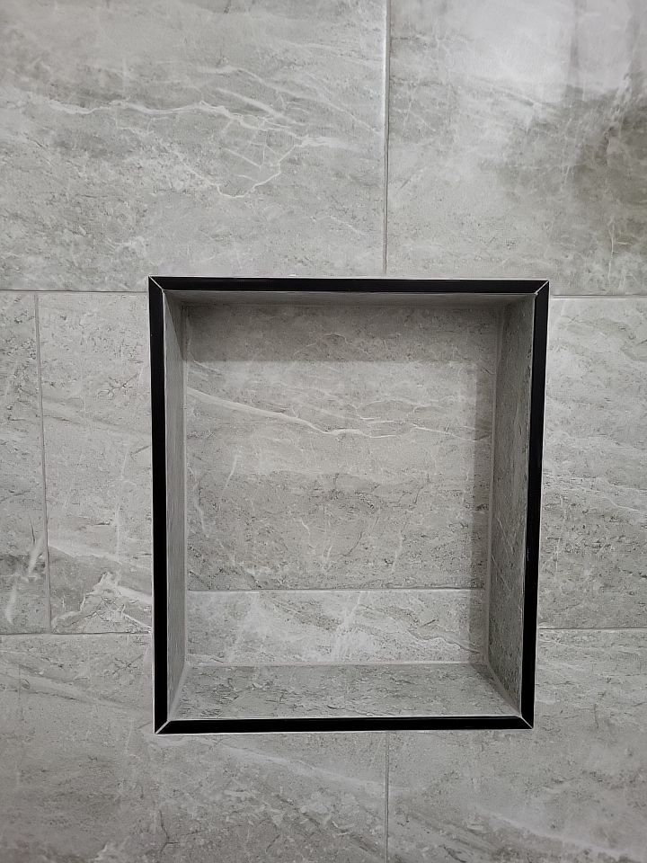 Bathroom Remodel using Tile  by SLM General Contractors & Roofing