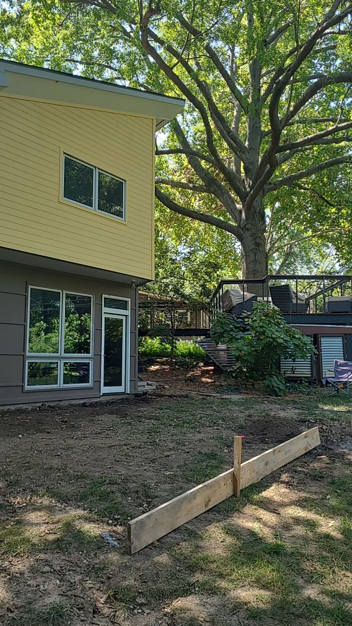 Back Yard Cantilivered Patio by LAND ESCAPES LLC