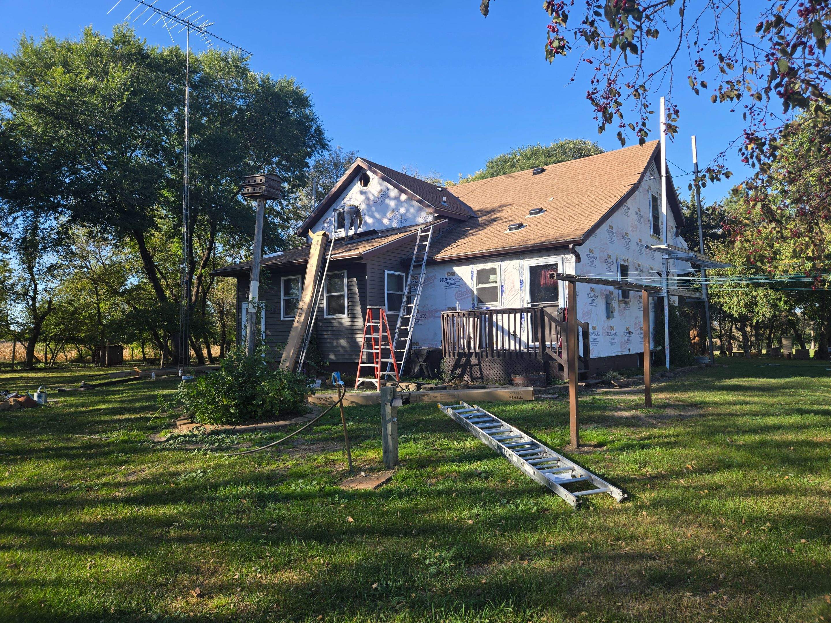 Royal Granite Siding Replacement & Brown Seamless Gutters by Next Level Seamless Gutters / Exteriors Inc.