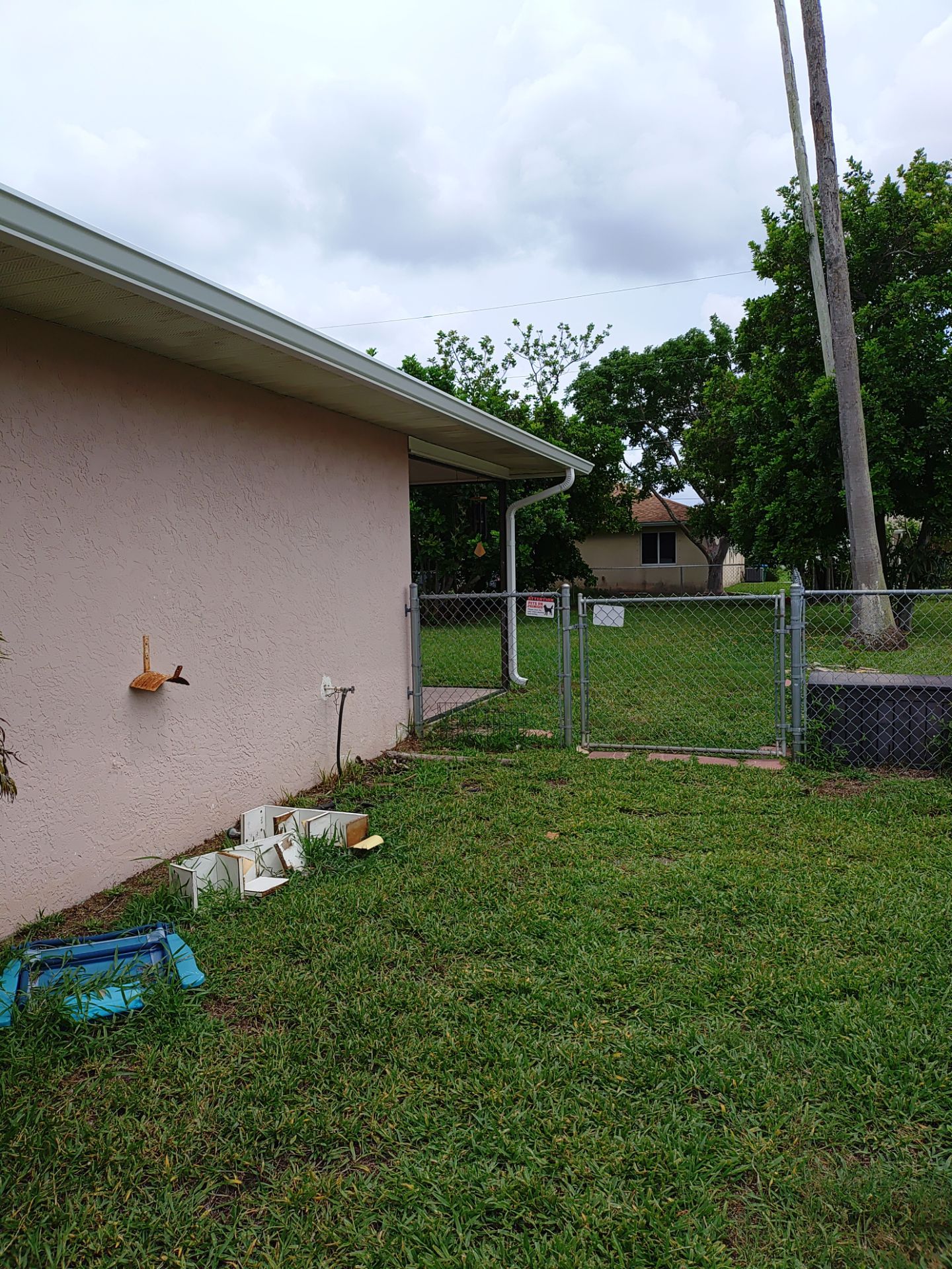 Replace gutter using White Down Spouts in Cape Coral FL by Gutter Professors
