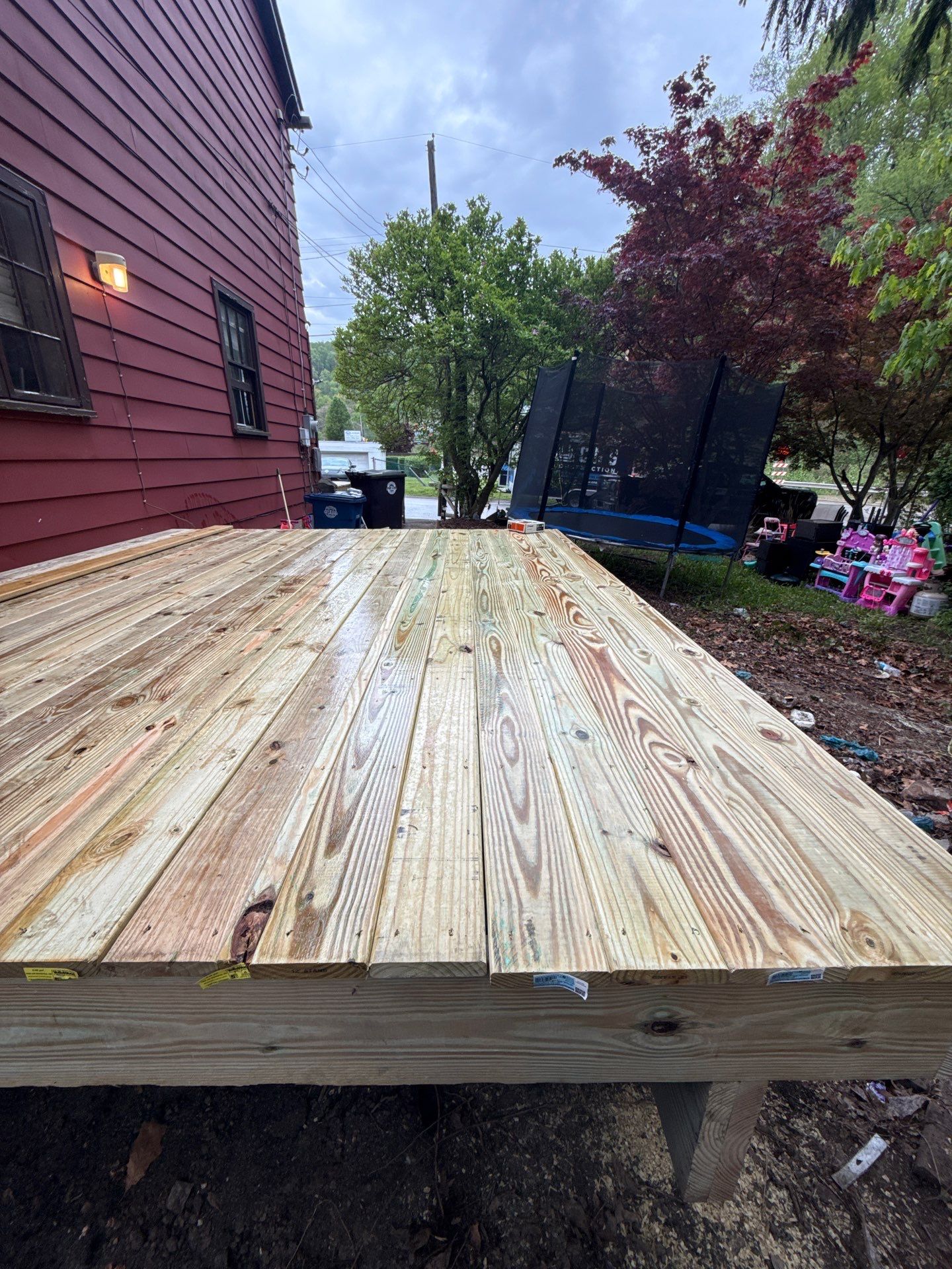 Roof sunspace deck  by Cousins Roofing Siding & Decks