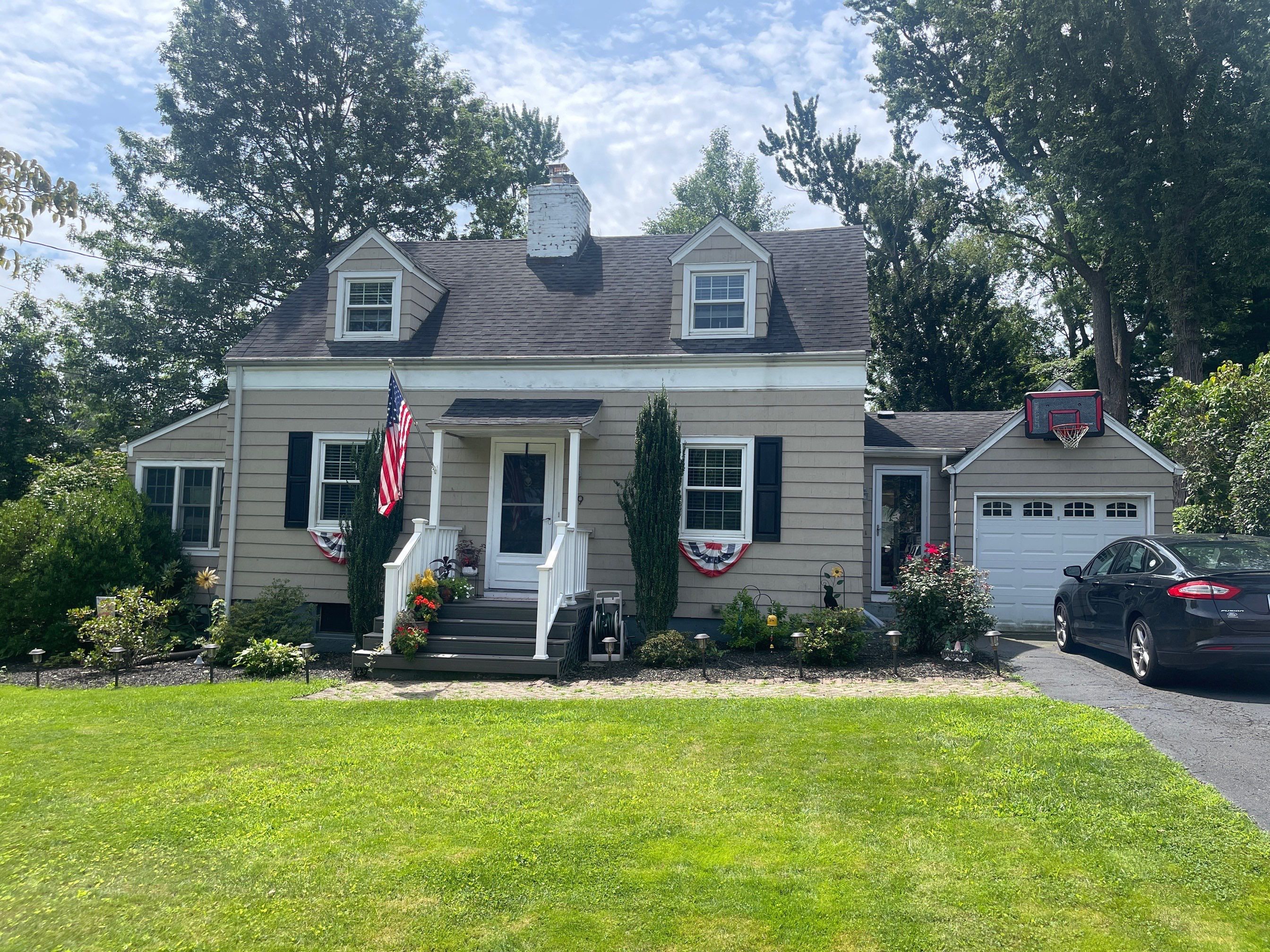 Complete Exterior Estate gray with Pacific Blue Siding by A Plus Exterior