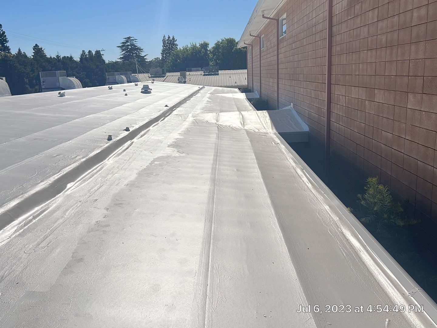 MR Roofing system using Benchmark/PUMA XL coatings over TPO single-ply roofing by Straight Edge Roofing Inc