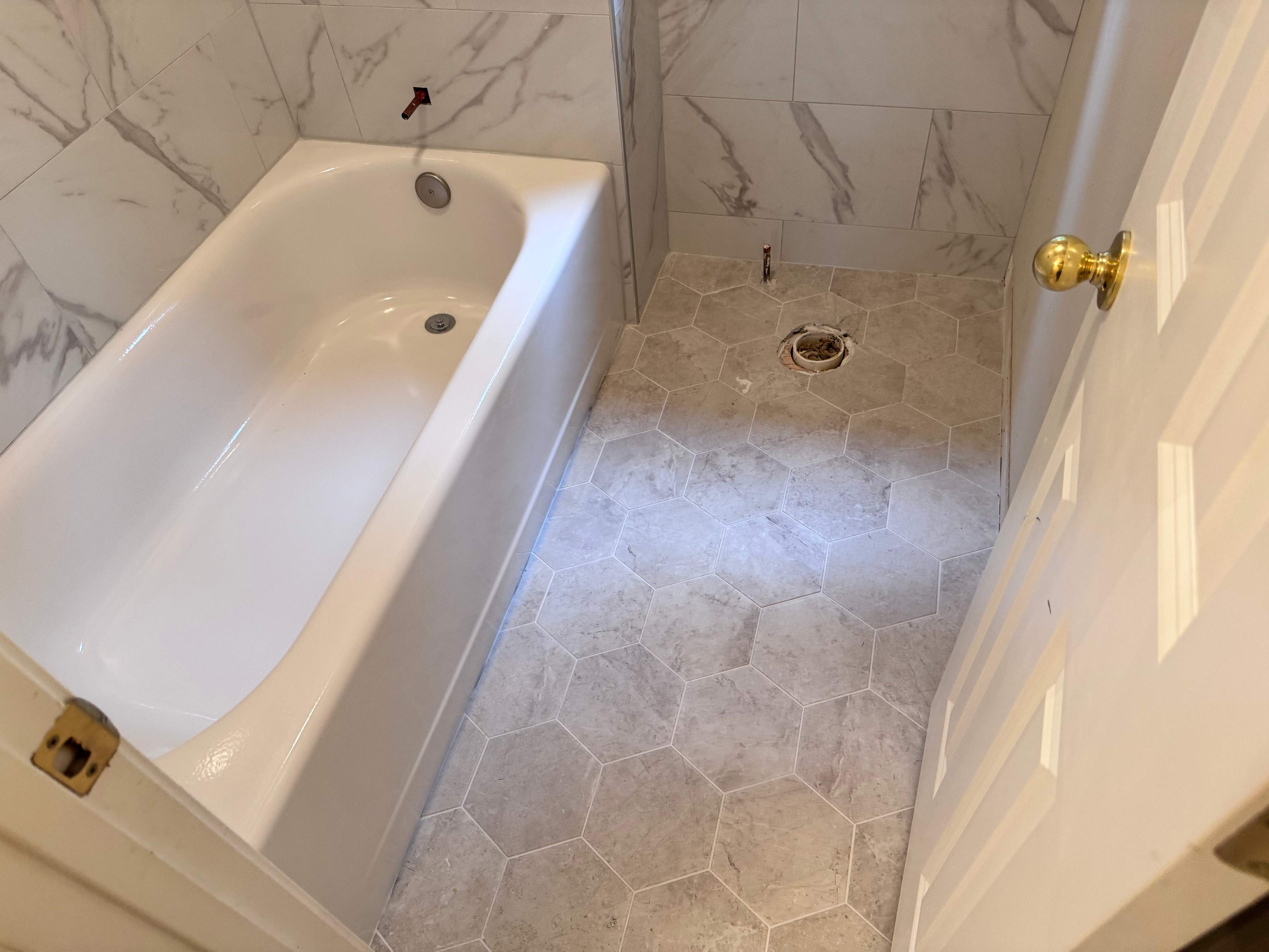 Tub and floor tile installation by Prudencio