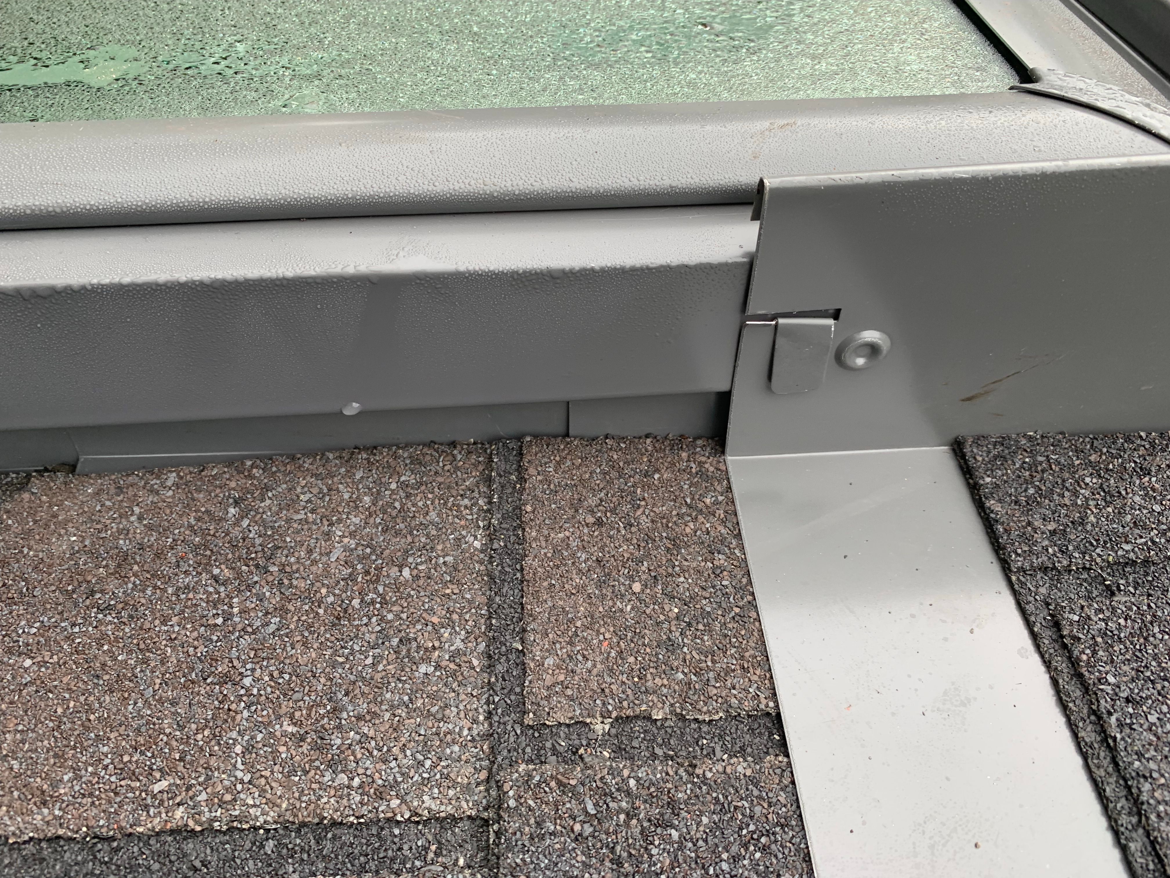 Skylight, Roof, and Gutter Replacement by American Home Contractors