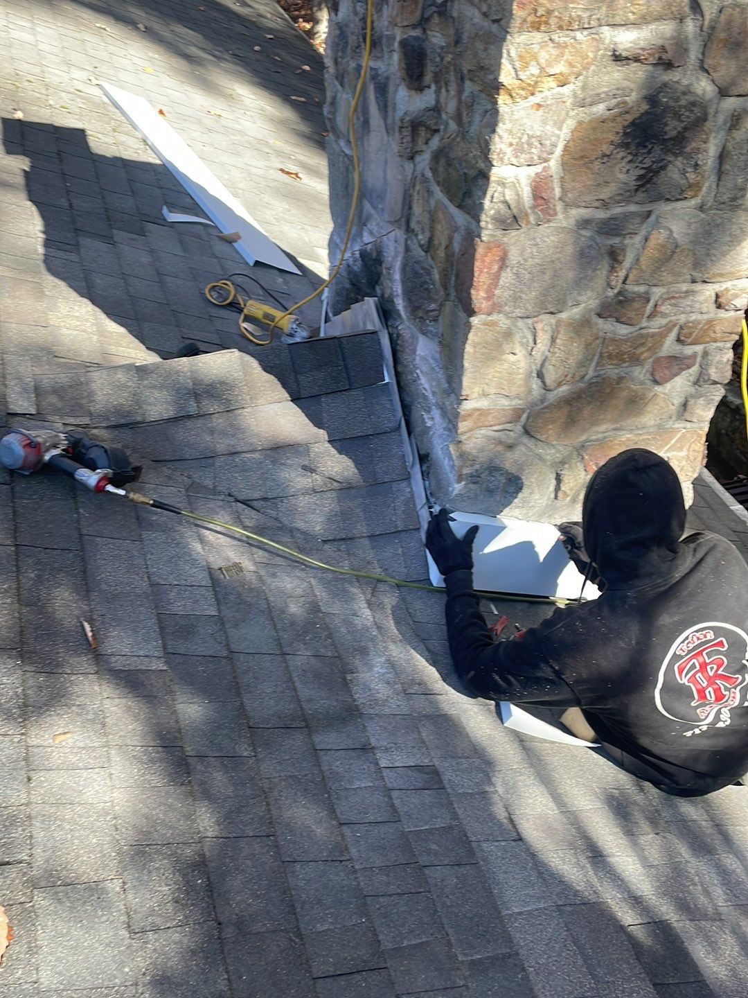 Insurance repair and chimney saddle installation. by Teflon Roofing