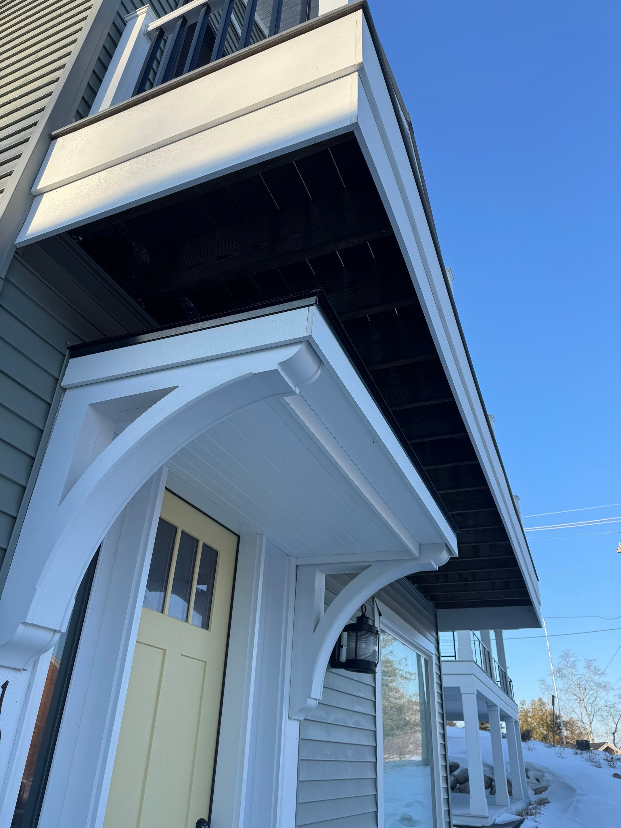 Custom Underdecking System and Soffit Installation in Charlevoix, Michigan by Rainbow Seamless Systems