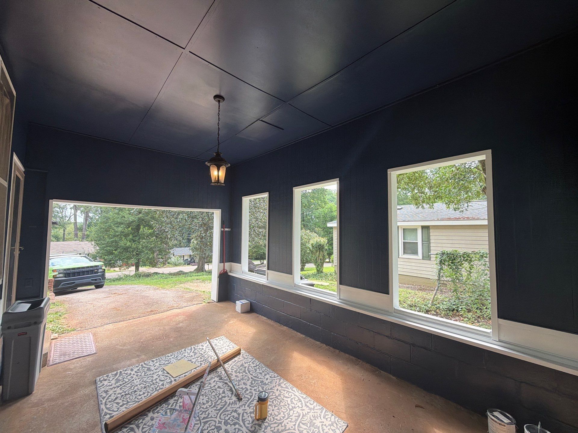 Full Exterior Repaint with Navy Blue and White Trim by Swift Home Renovations