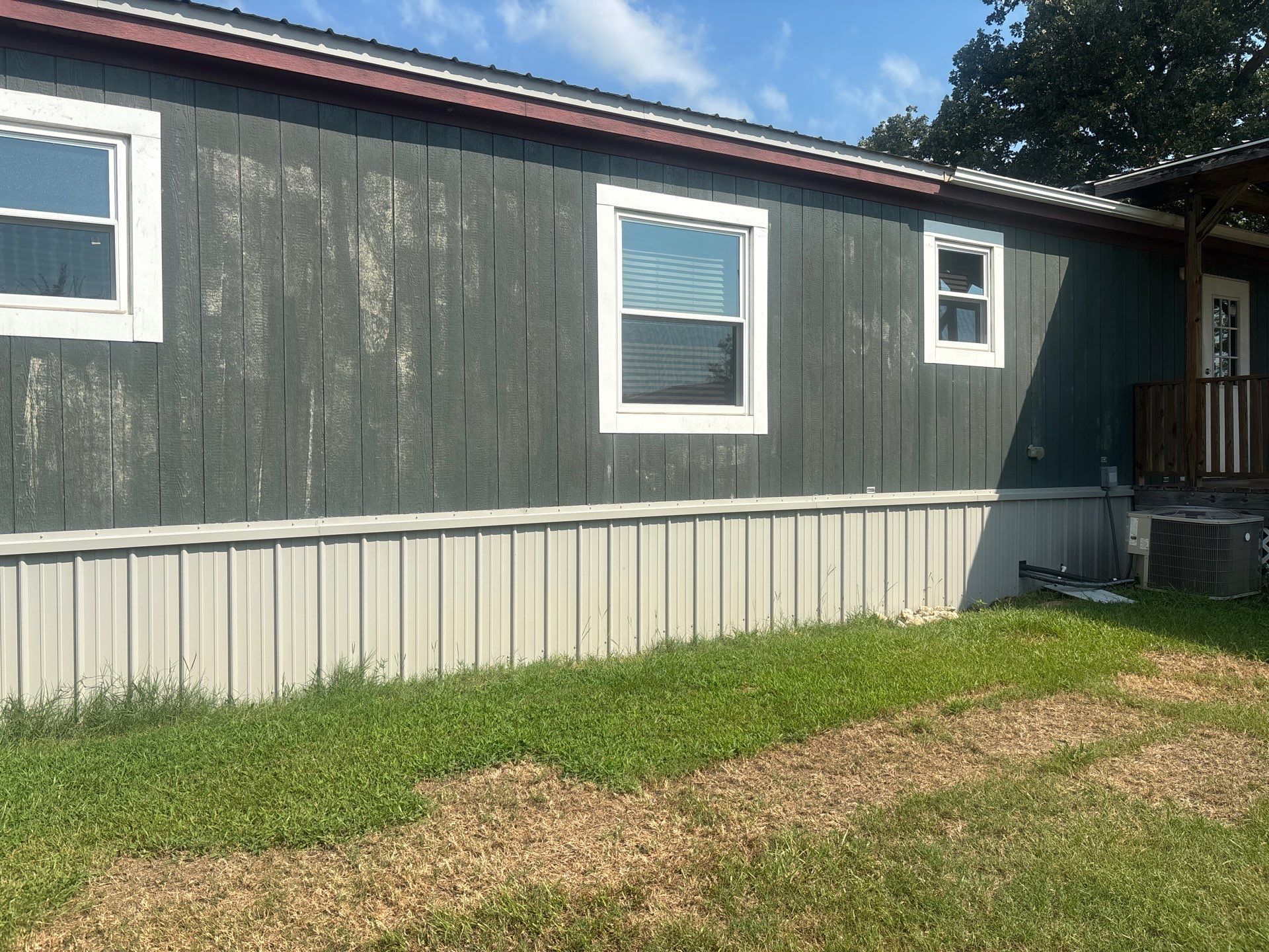 Exterior Painting in Fruitvale, TX | Wood Porch & Home in Deep Navy Blue by Quality Coats Painting