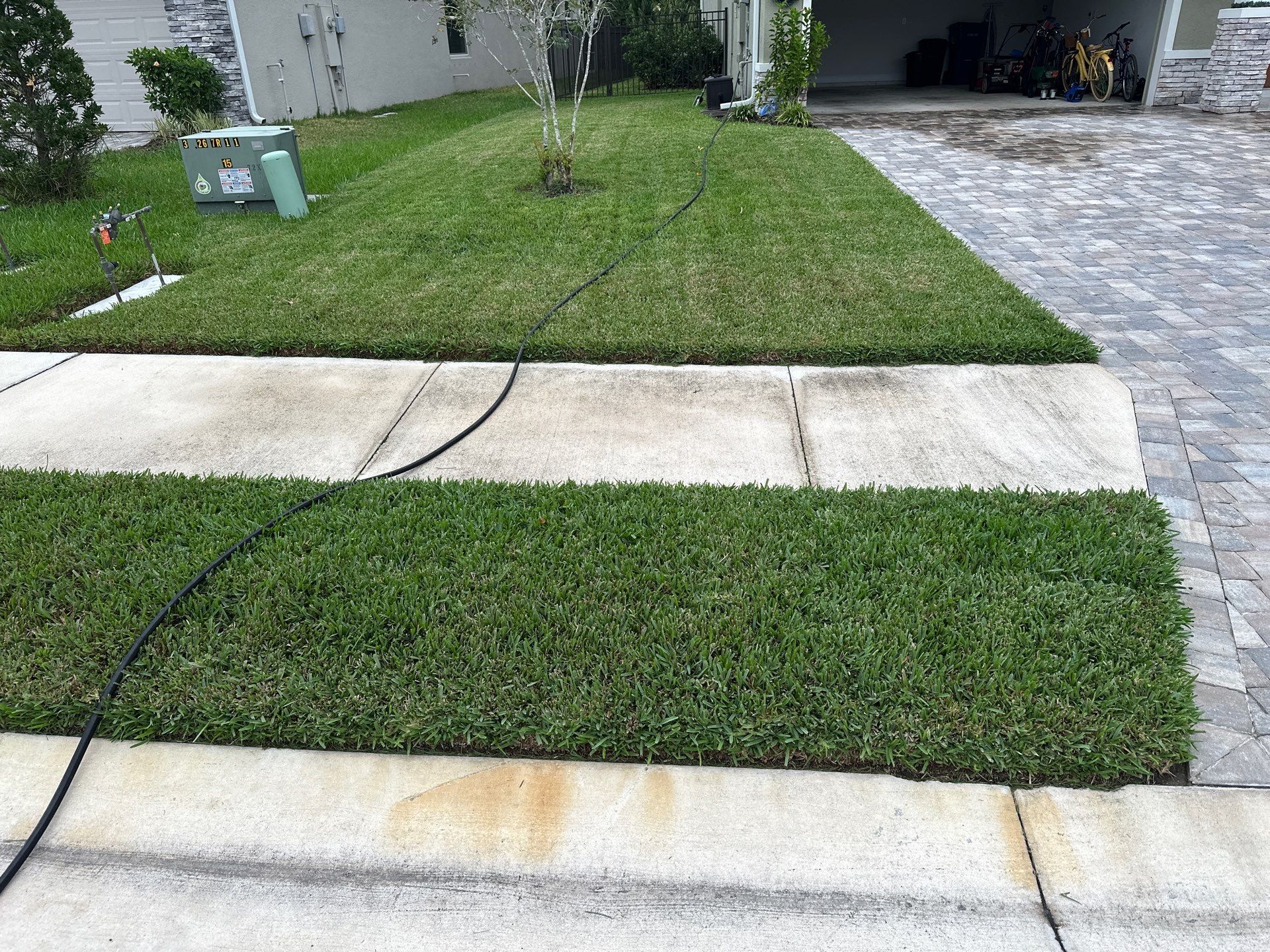House Wash, Paver Driveway & Sidewalk Cleaning + Sanding & Sealing in Trevesta Community, Palmetto, FL by Sunshine AquaWash