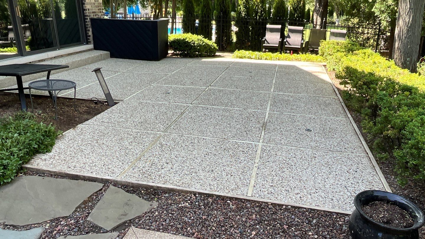 Aggregate concrete cleaning and sealing using Surebond SB-9000 by Northern Power Washing LLC.