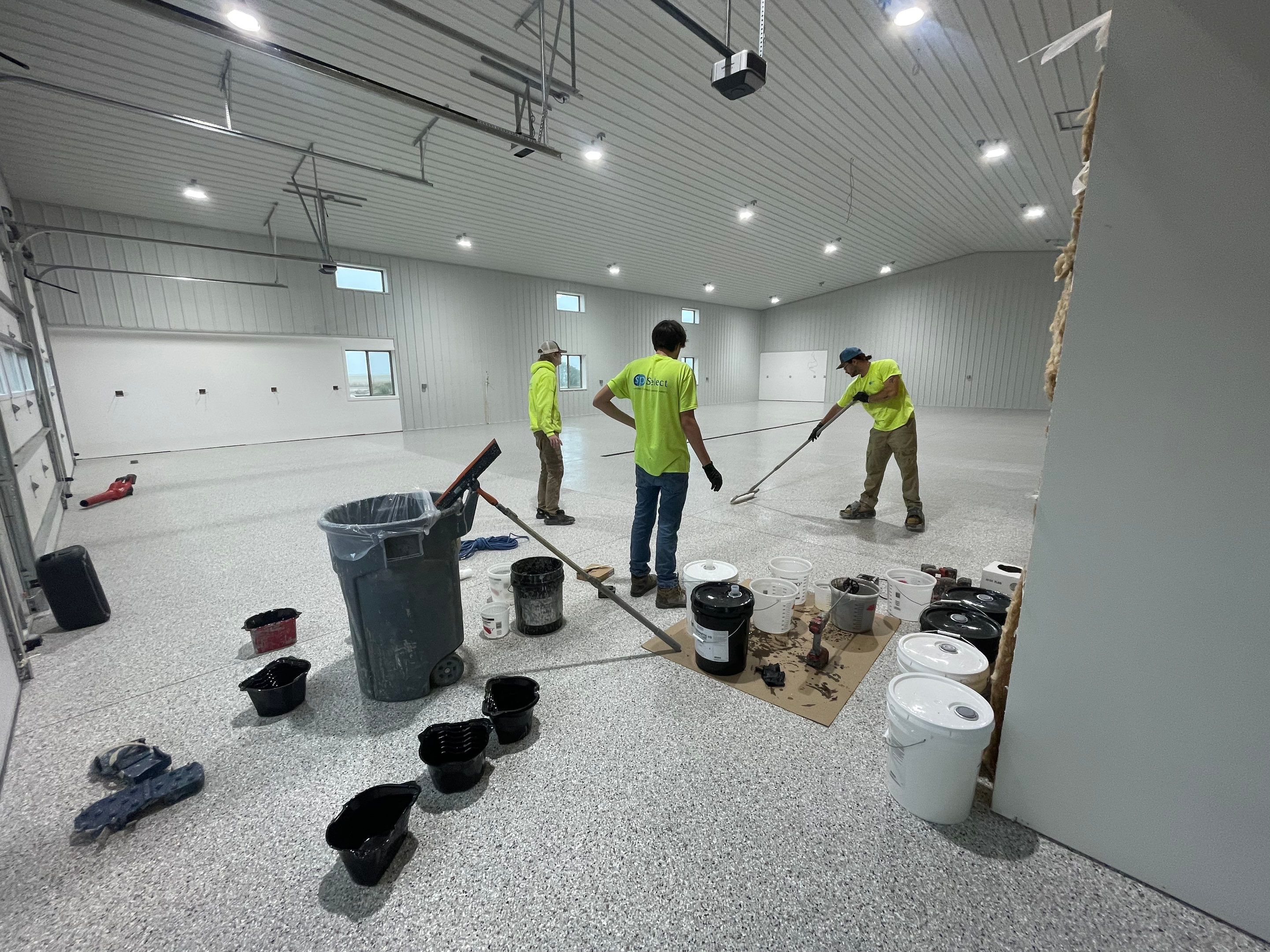 Custom Speckled Floor Coating for Large Montrose Shop by Select Painting, Coatings & Garage Cabinets