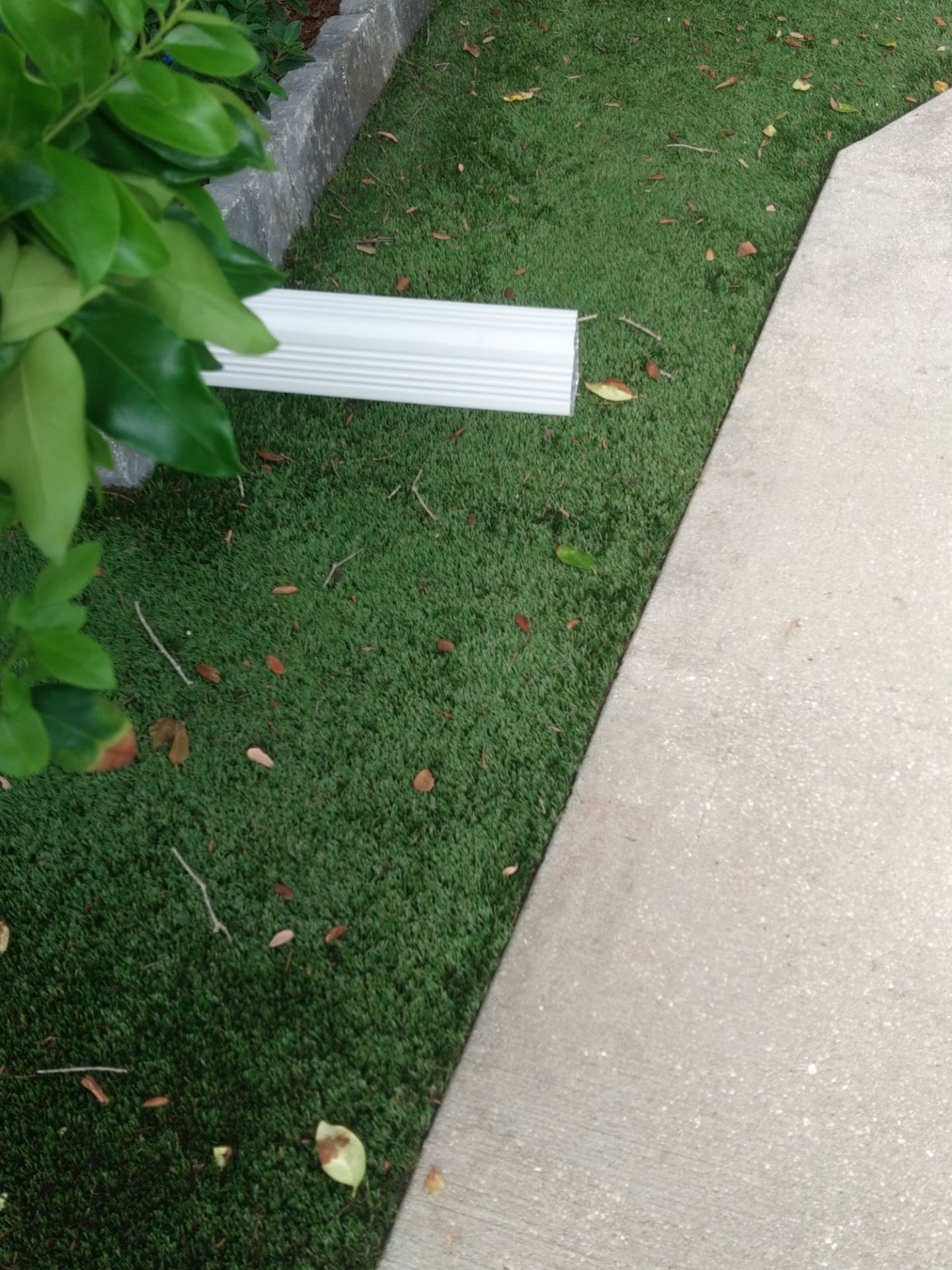 Seamless aluminum gutter installation in Sarasota, FL using 3x4 elbow downspouts combined with round downspouts by Gutter Professors