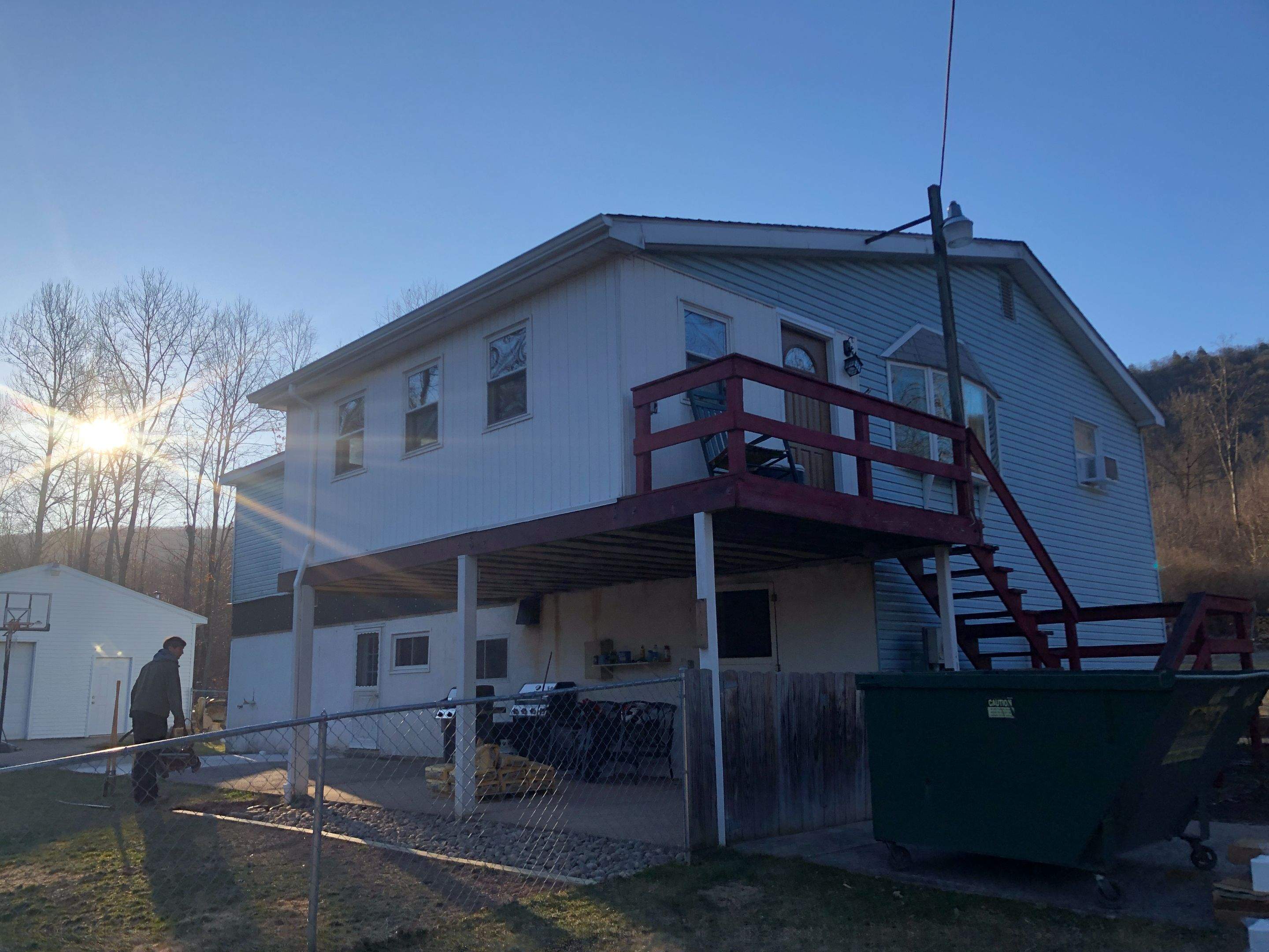 Sage Green Vinyl Siding and Exterior Trim Replacement in Ashland by Esh Builders