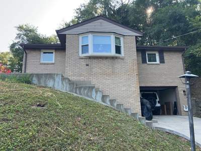 White Brick Exterior Painting and Dark Trim Transformation in Pittsburgh