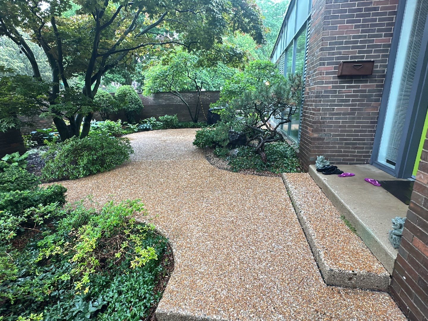 Aggregate and natural stone patio cleaning by Northern Power Washing LLC.