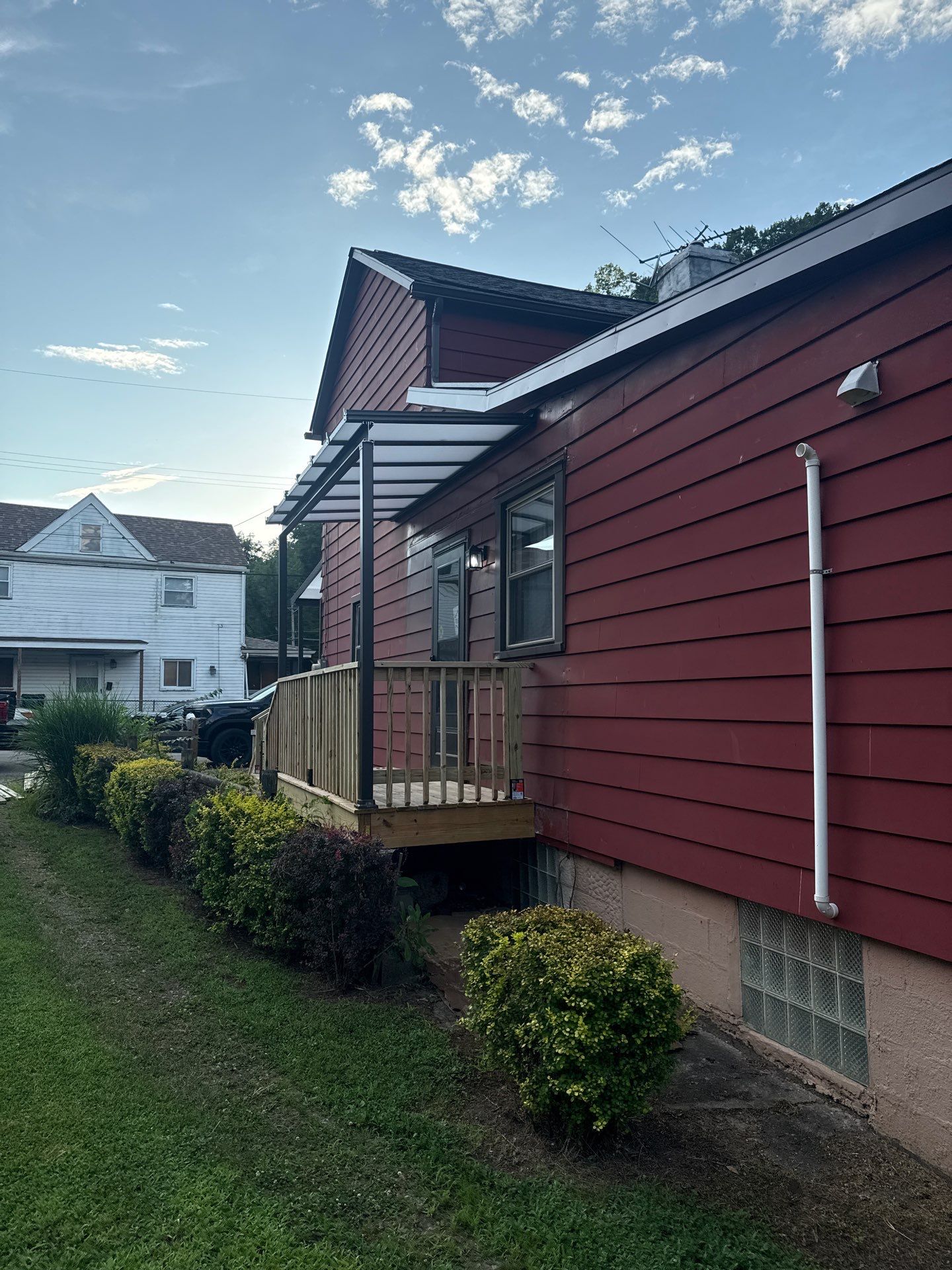 Roof sunspace deck  by Cousins Roofing Siding & Decks