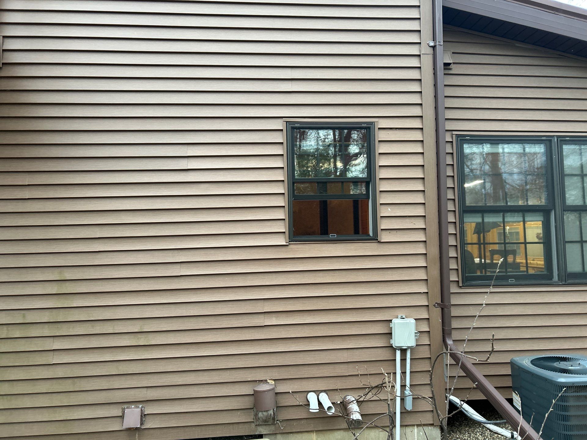 Pella Window installation using Pella Lifestyle wood/Aluminum window by United Windows and Siding LLC