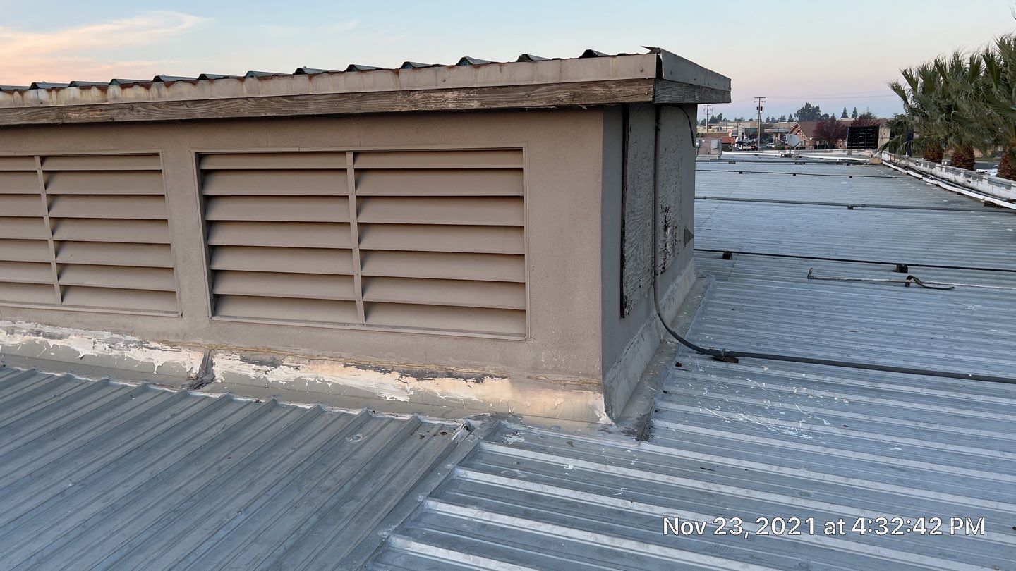 Metal roof restoration on commercial roof using Conklin Benchmark/ PUMA XL acrylic coatings over metal and foam by Straight Edge Roofing Inc