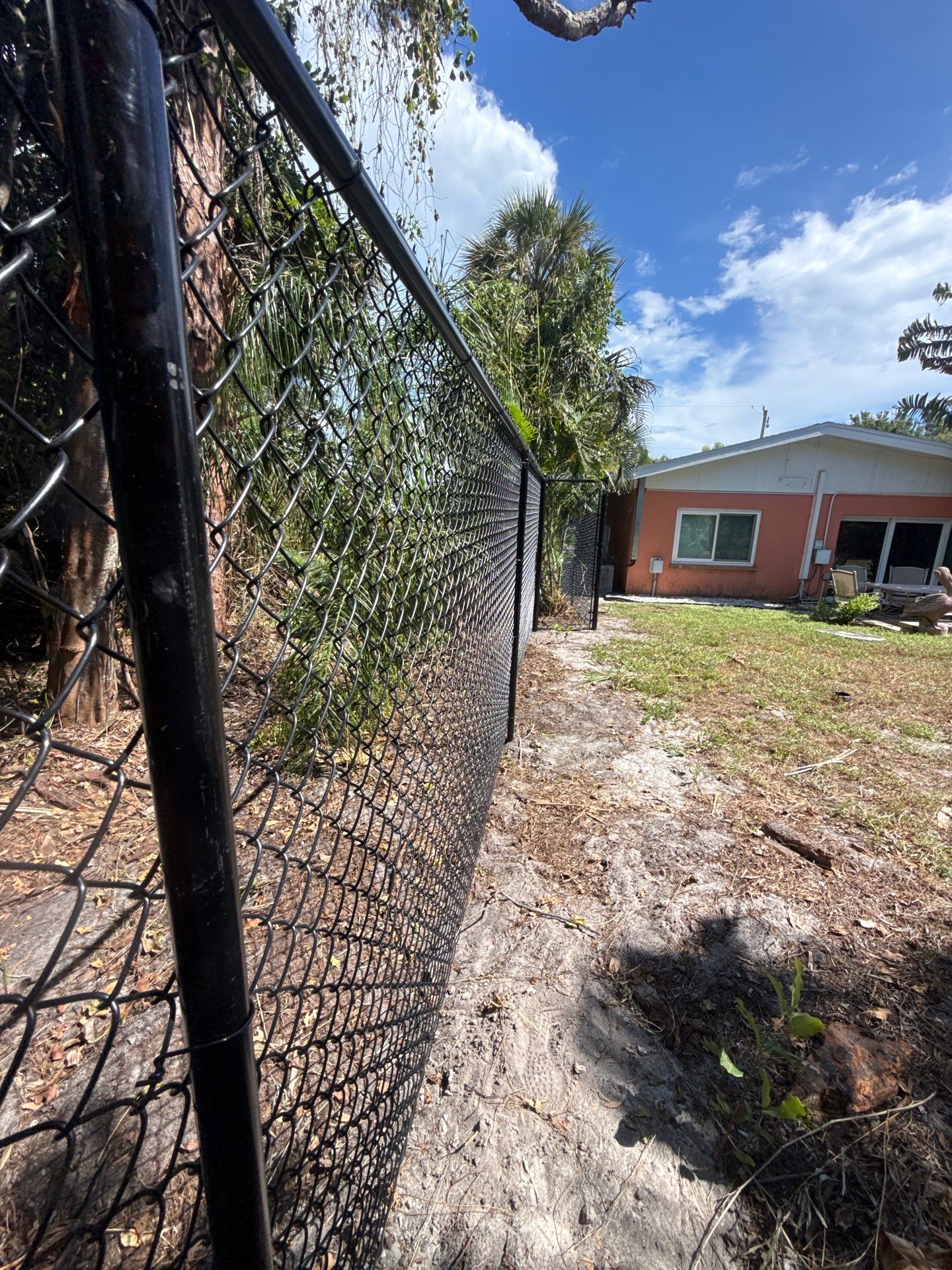Black Chain Link Fence Installation and Site Clearing in Nokomis by True Fence LLC