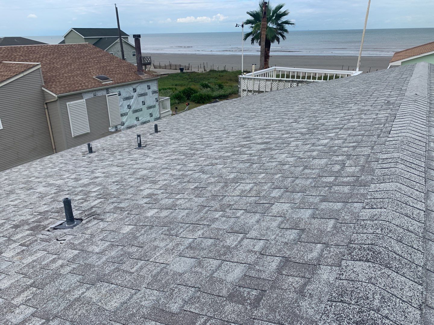 Galveston Waterfront Roof Installation In Progress by Elite Roofing LLC