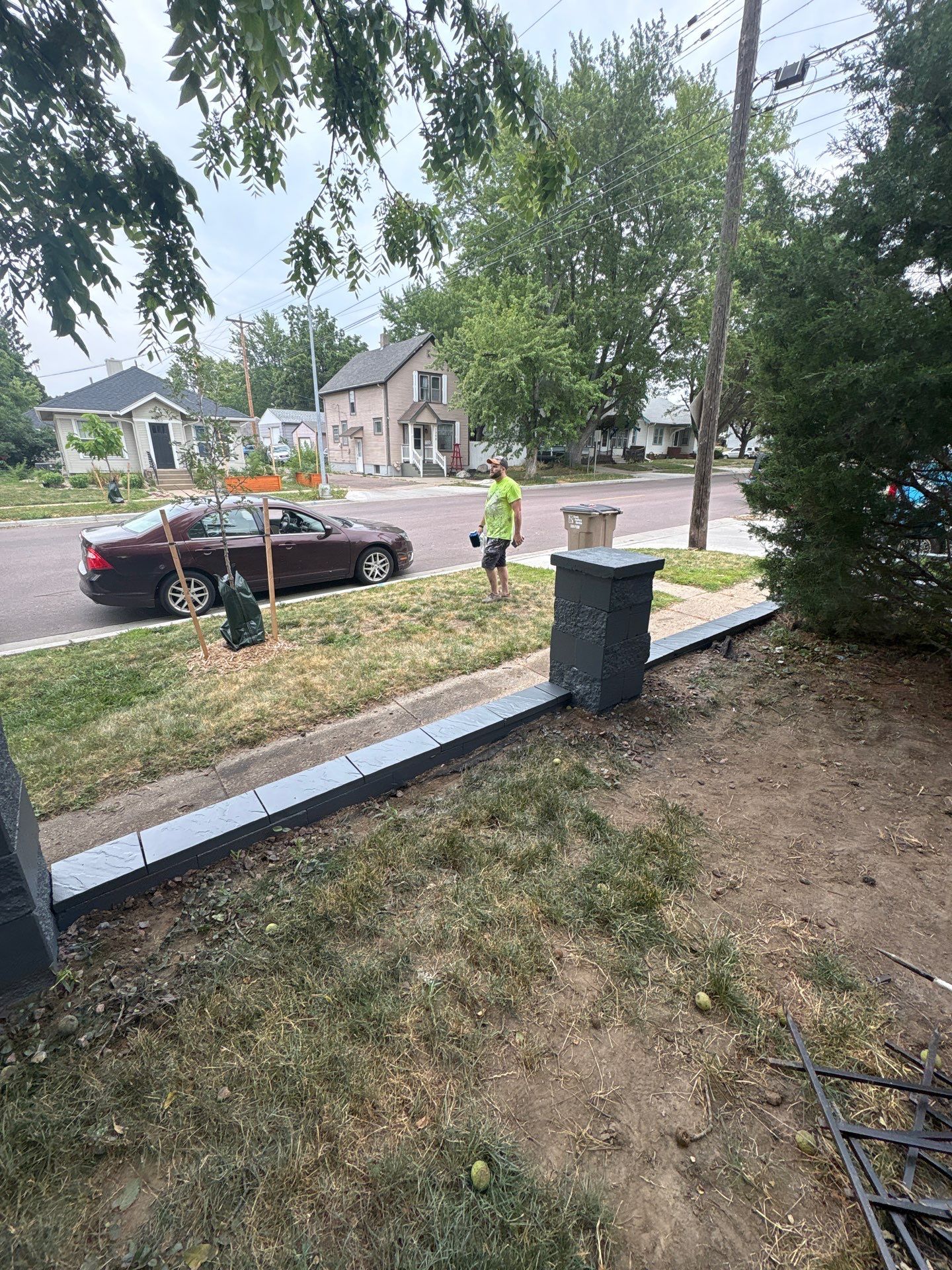 Exterior Masonry Painting for a Sioux Falls Retaining Wall by Select Painting, Coatings & Garage Cabinets