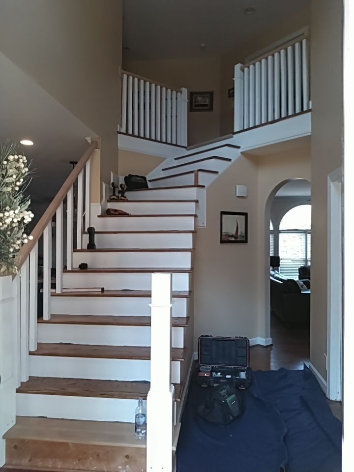 Stairway Installation using Red oak modern railings by House Custom Carpentry, LLC