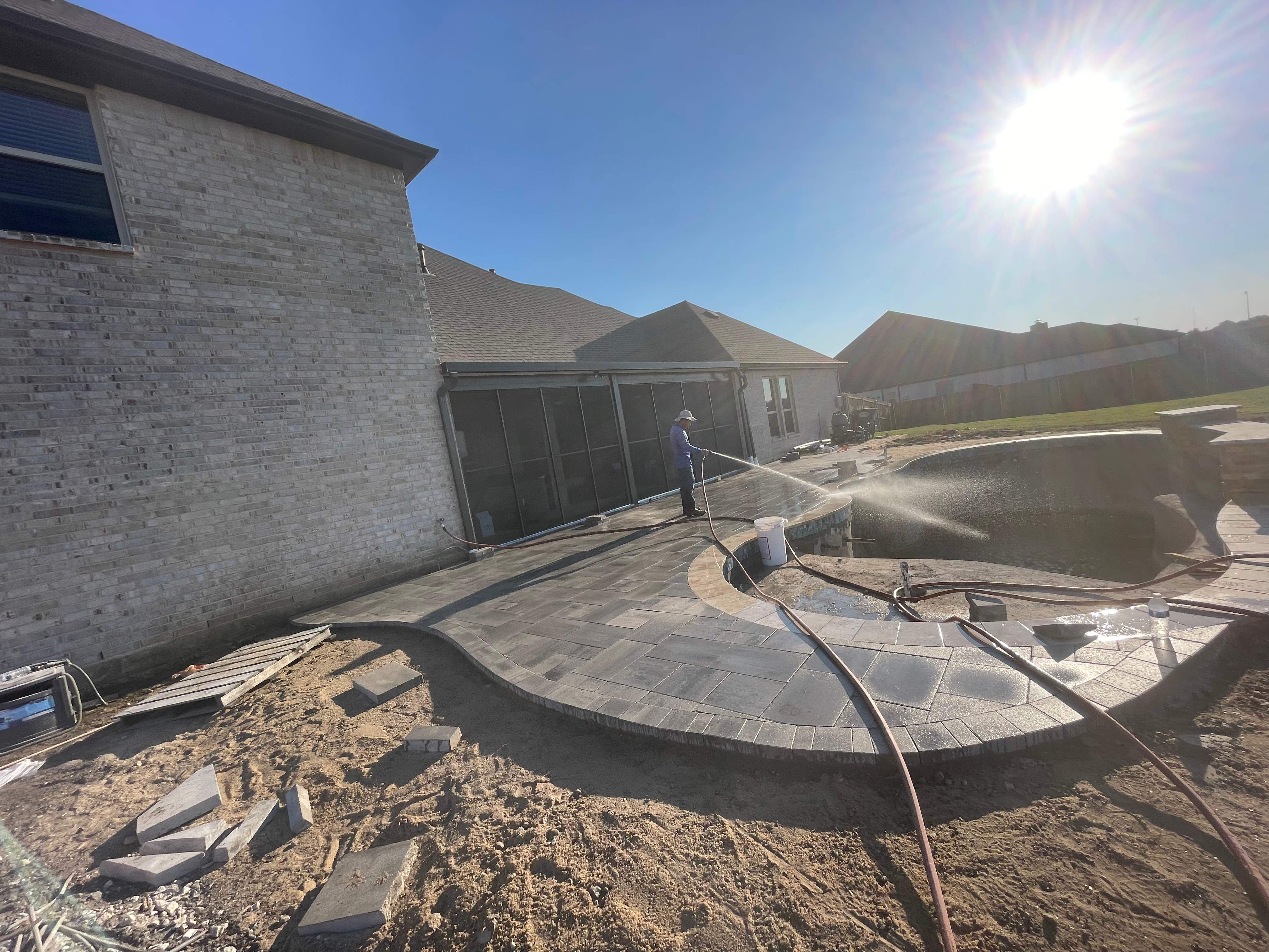 Freeform Pool with Raised Stone Accent Wall by Pinnacle Pools and Spas - DFW