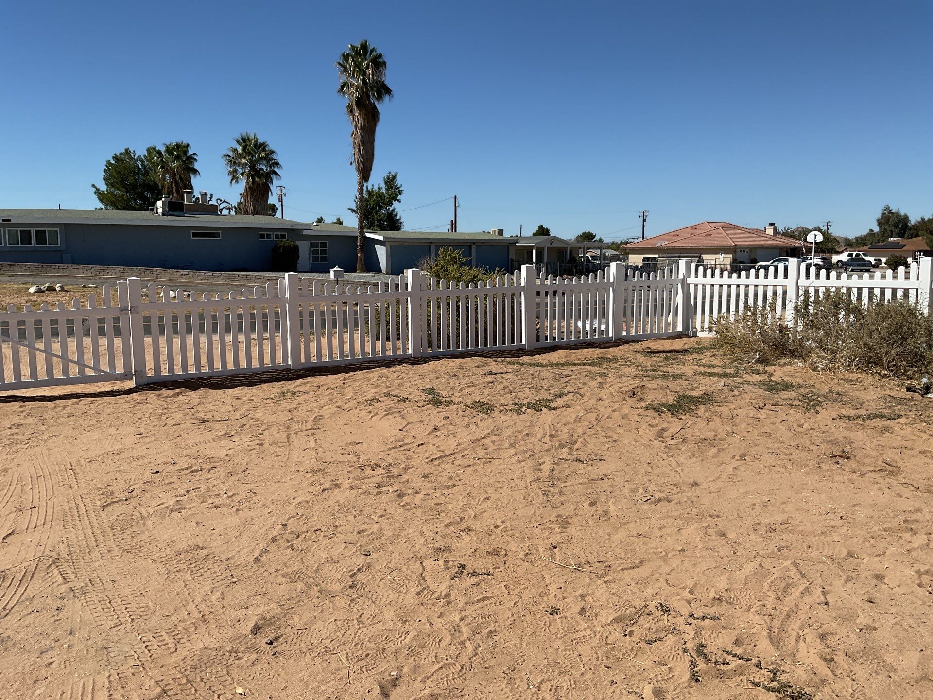 White picket fence  by Fence Guys Inc. 