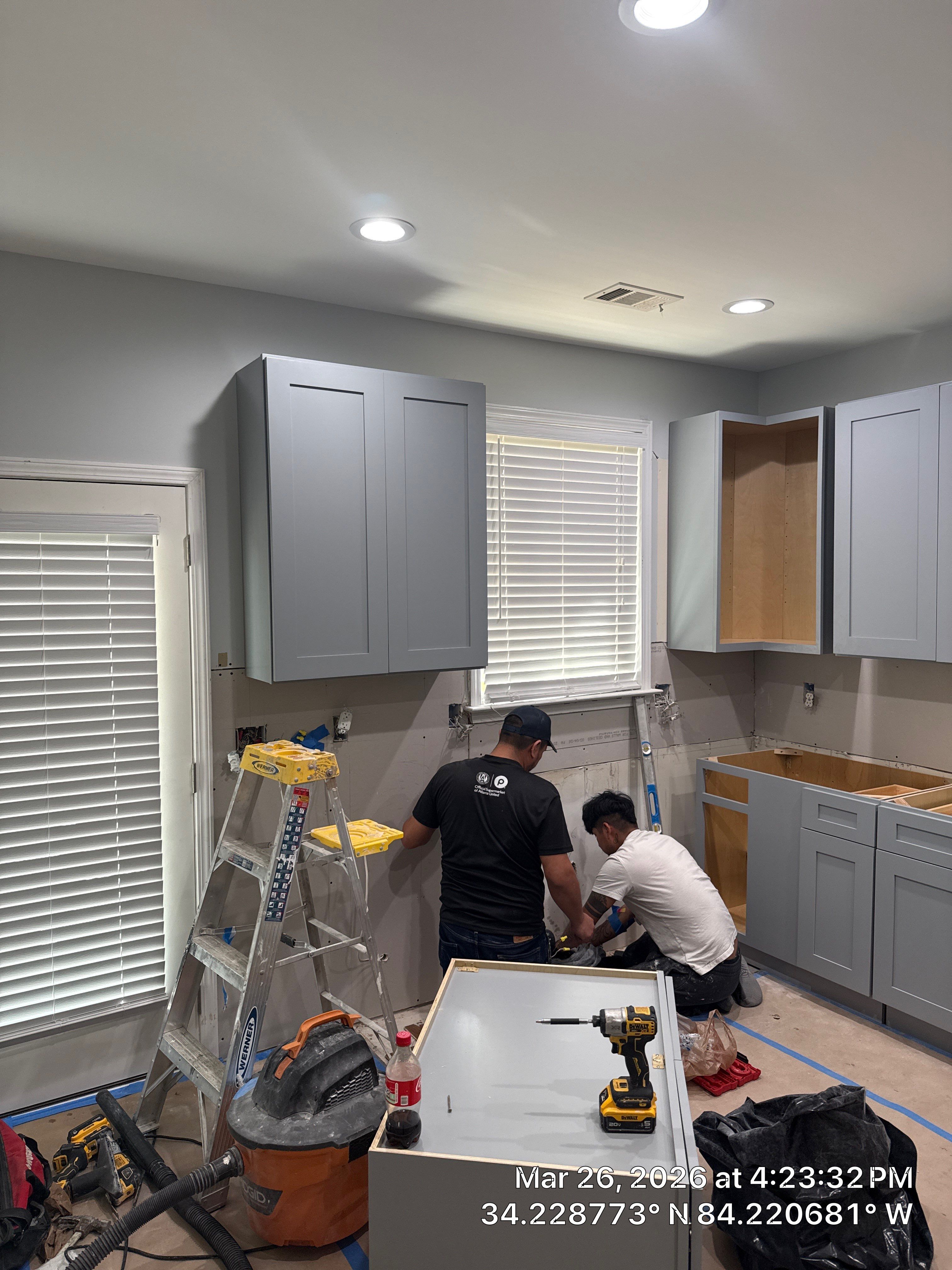 Modern Kitchen Remodel With Grey Shaker Cabinets and Navy Blue Island by Heart & Home Kitchen & Bath Remodeling LLC