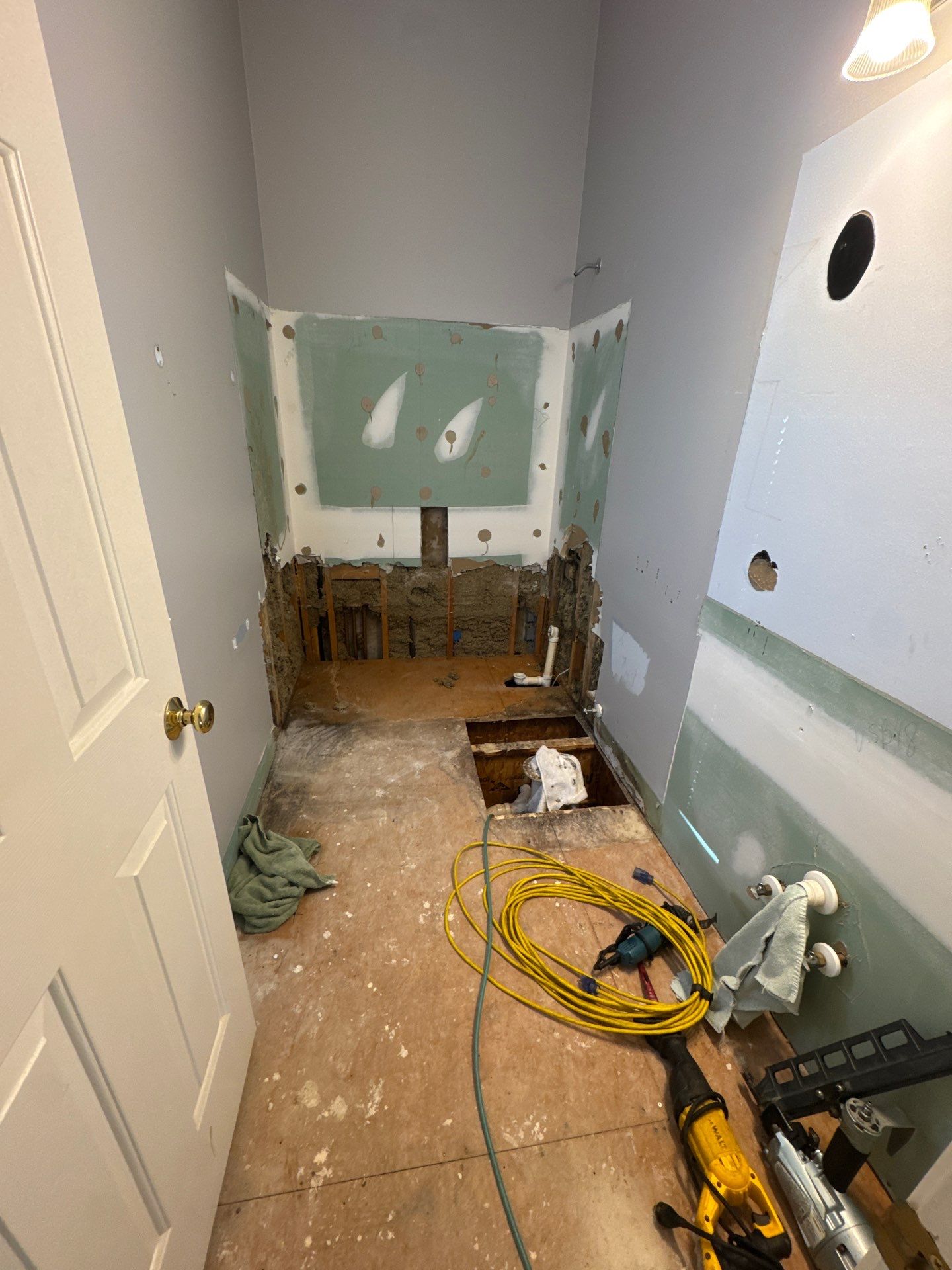 Marietta Bathroom Remodel with Marble Tile and Pebble Floor by Swift Home Renovations