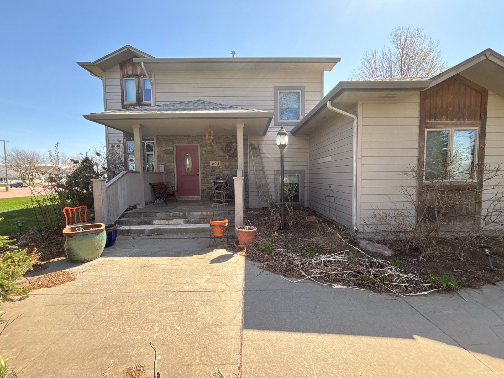 Exterior Siding and Trim Painting for Sioux Falls Residence by Select Painting, Coatings & Garage Cabinets